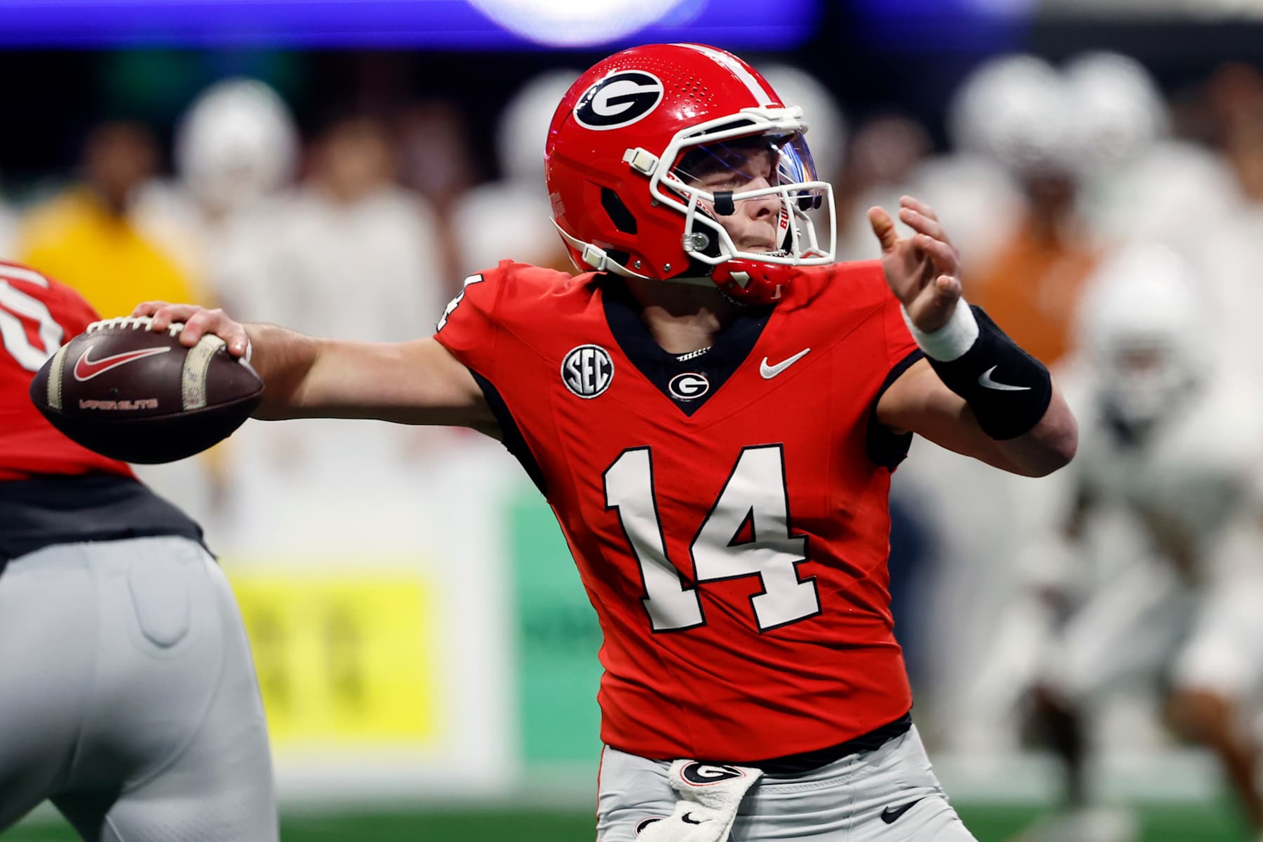 ATLANTA, GEORGIA - DECEMBER 07: Gunner Stockton #14 of the Georgia Bulldogs throws a pass against the Texas Longhorns during the third quarter of the 2024 SEC Championship at Mercedes-Benz Stadium on December 07, 2024 in Atlanta, Georgia. (Photo by Butch Dill/Getty Images) ATLANTA, GEORGIA - DECEMBER 07: Gunner Stockton #14 of the Georgia Bulldogs throws a pass against the Texas Longhorns during the third quarter of the 2024 SEC Championship at Mercedes-Benz Stadium on December 07, 2024 in Atlanta, Georgia. (Photo by Butch Dill/Getty Images)