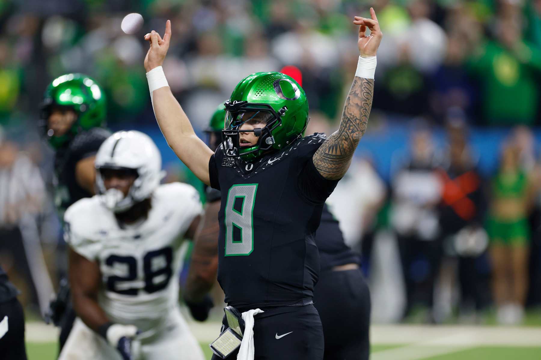 INDIANAPOLIS, IN - DECEMBER 07: Oregon Ducks quarterback Dillon Gabriel (8) celebrates after a touchdown pass during the Big Ten Championship Game against the Penn State Nittany Lions on December 07, 2024 at Lucas Oil Stadium in Indianapolis, Indiana. (Photo by Joe Robbins/Icon Sportswire via Getty Images)
