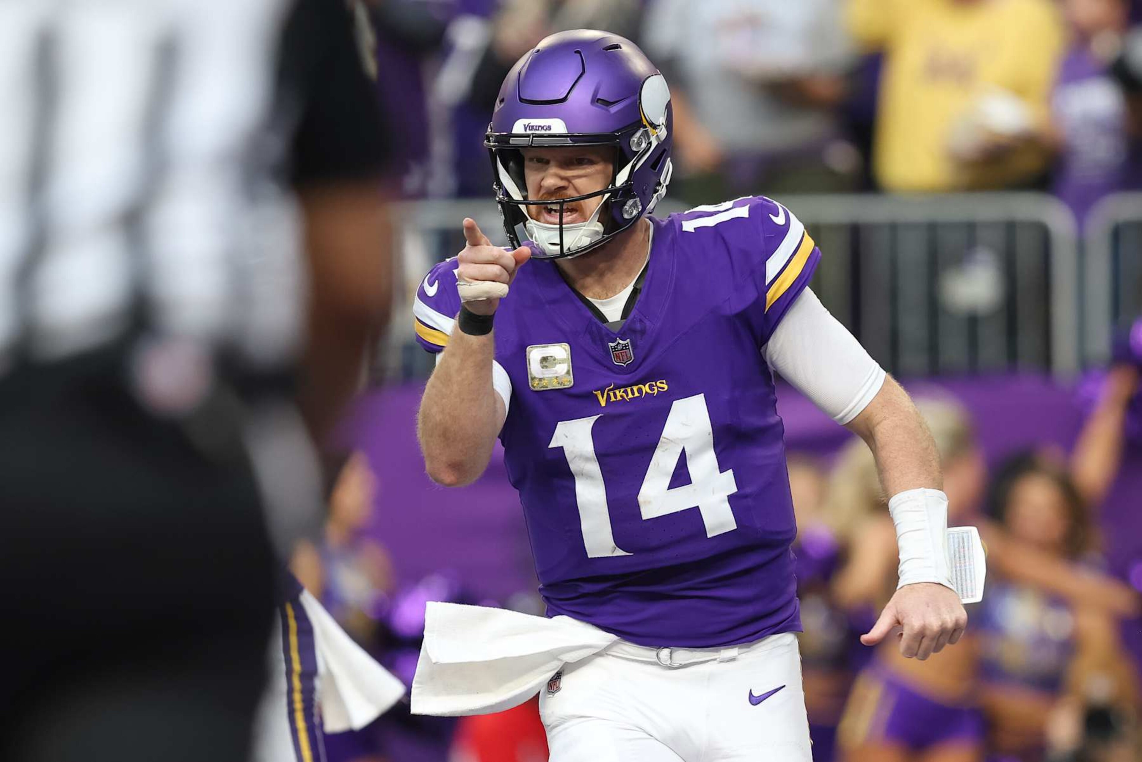 MINNEAPOLIS, MN - DECEMBER 01: Minnesota Vikings quarterback Sam Darnold (14) points after throwing for a touchdown during the NFL game between the Arizona Cardinals and the Minnesota Vikings on December 1st, 2024, at U.S. Bank Stadium in Minneapolis, MN. (Photo by Bailey Hillesheim/Icon Sportswire via Getty Images)