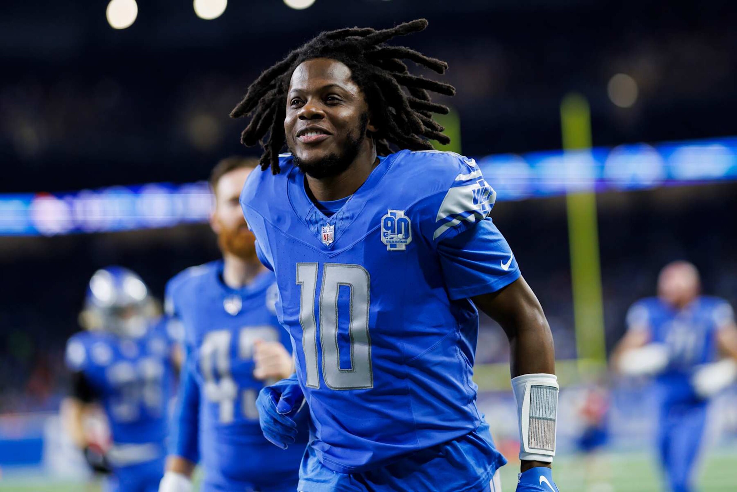 DETROIT, MICHIGAN - DECEMBER 16: Teddy Bridgewater #10 of the Detroit Lions runs off the field during an NFL football game against the Denver Broncos at Ford Field on December 16, 2023 in Detroit, Michigan. (Photo by Ryan Kang/Getty Images)