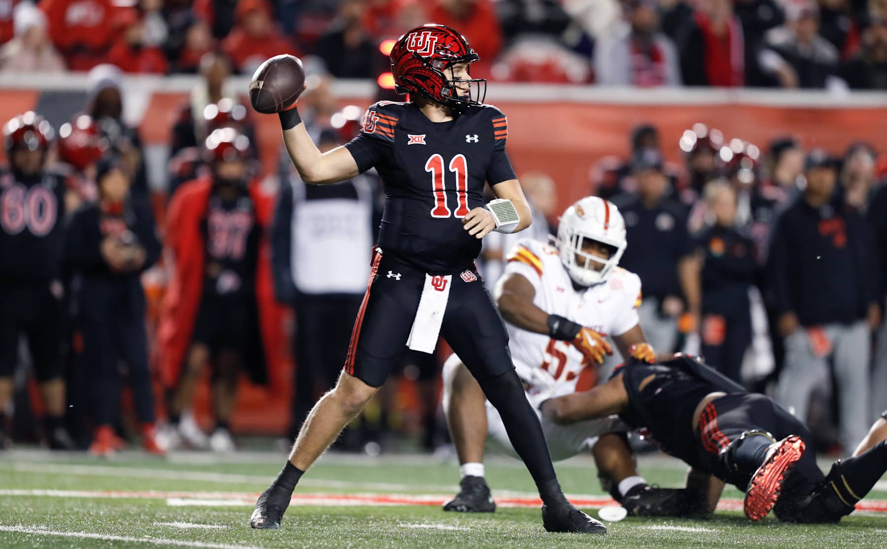 SALT LAKE CITY , UT - NOVEMBER 23: Isaac Wilson #11 of the Utah Utes throws a pass against the Iowa State Cyclones during the first half of their game at the Rice-Eccles Stadium on November 23, 2024 in Salt Lake City, Utah.(Photo by Chris Gardner/Getty Images)