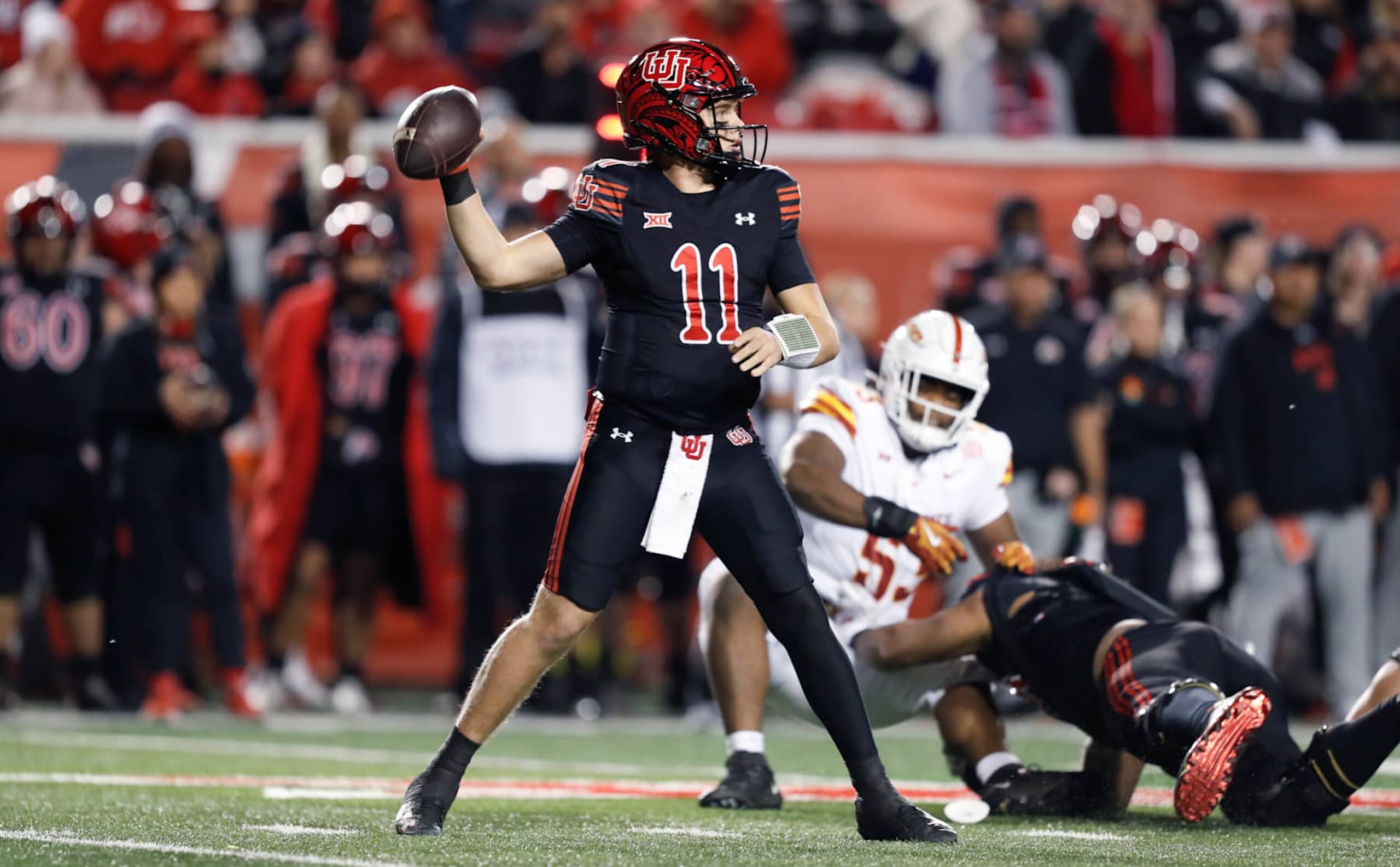 SALT LAKE CITY , UT - NOVEMBER 23: Isaac Wilson #11 of the Utah Utes throws a pass against the Iowa State Cyclones during the first half of their game at the Rice-Eccles Stadium on November 23, 2024 in Salt Lake City, Utah.(Photo by Chris Gardner/Getty Images)