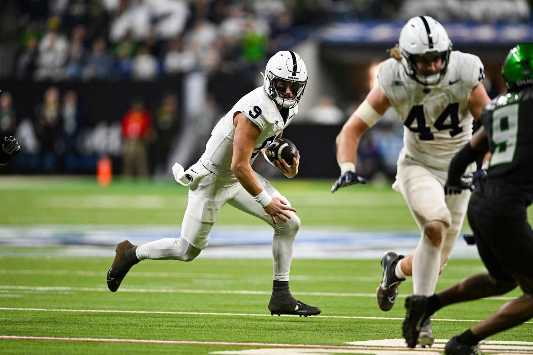 INDIANAPOLIS, IN - DECEMBER 07: Penn State Nittany Lions QB Beau Pribula (9) runs the ball during the Big Ten Championship football game between the Penn State Nittany Lions and the Oregon Ducks on December 7, 2024 at Lucas Oil Stadium in Indianapolis, IN (Photo by James Black/Icon Sportswire via Getty Images)