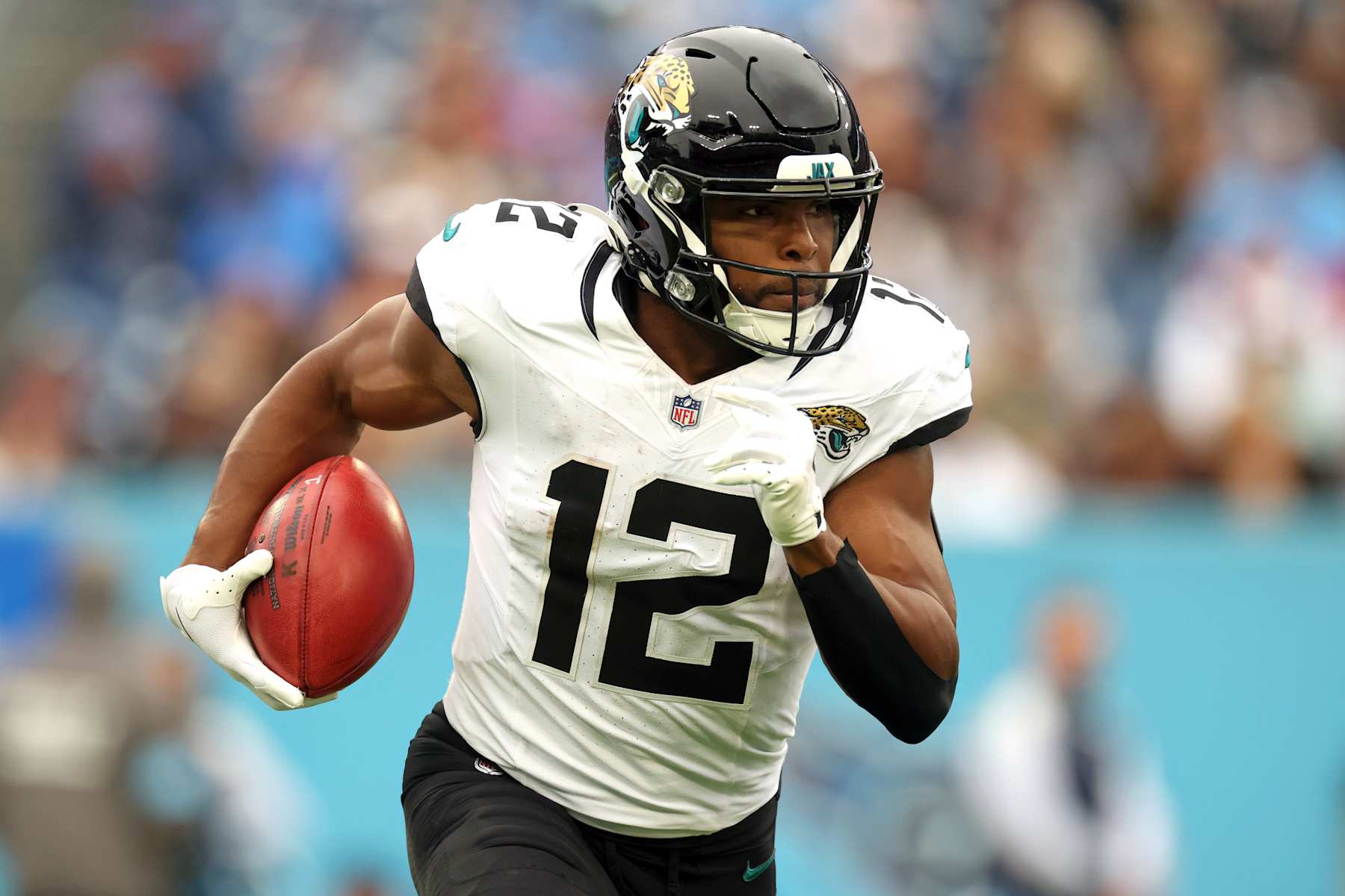 NASHVILLE, TENNESSEE - DECEMBER 08: Devin Duvernay #12 of the Jacksonville Jaguars returns a punt during the third quarter against the Tennessee Titans at Nissan Stadium on December 08, 2024 in Nashville, Tennessee. (Photo by Andy Lyons/Getty Images)