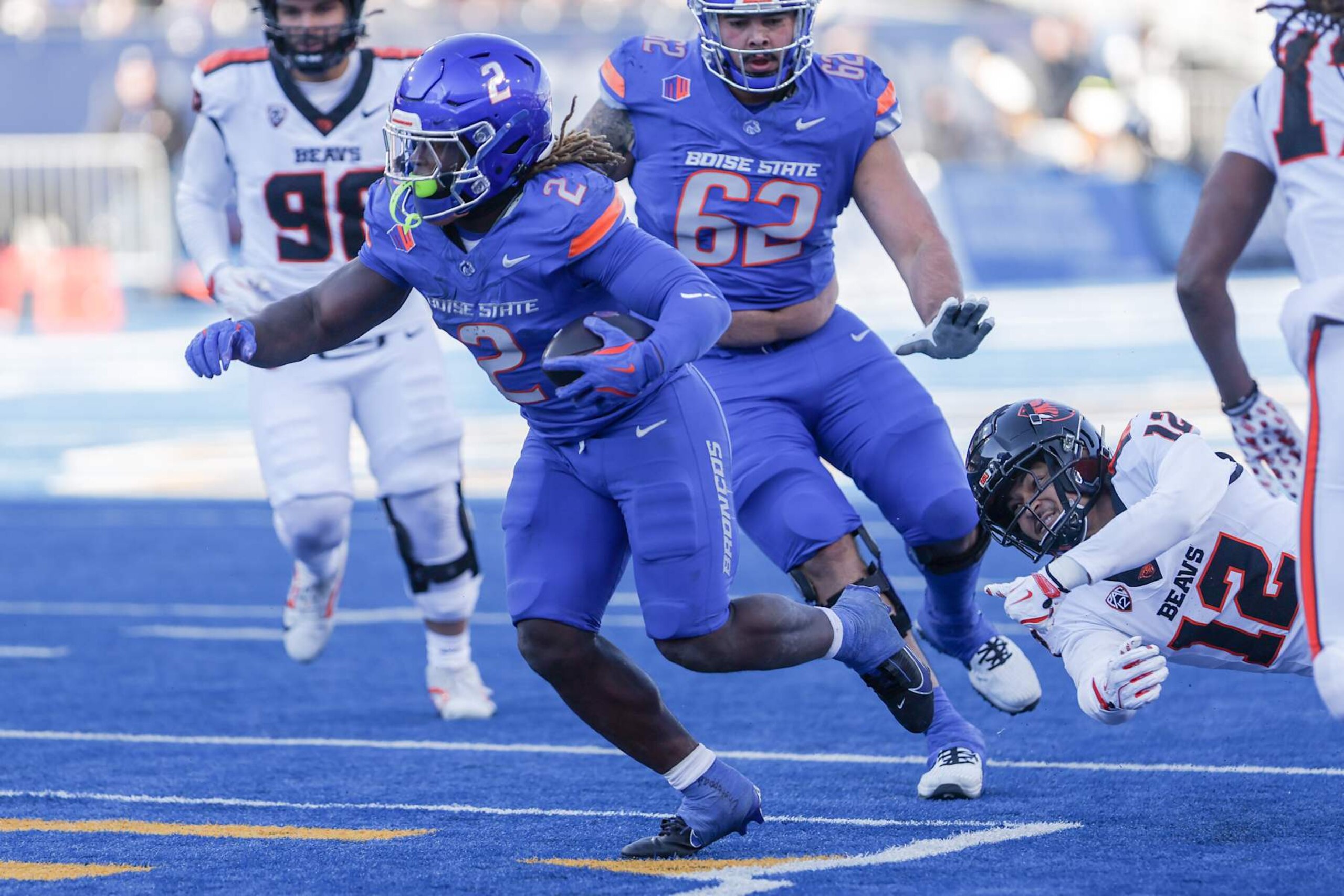 BOISE, ID - NOVEMBER 29: Running back Ashton Jeanty #2 of the Boise State Broncos slips through the tackle attempt of defensive back Tyrice Ivy Jr. #12 of the Oregon State Beavers during the second half t Albertsons Stadium on November 29, 2024 in Boise, Idaho. Boise State won the game 34-18. (Photo by Loren Orr/Getty Images) BOISE, ID - NOVEMBER 29: Running back Ashton Jeanty #2 of the Boise State Broncos slips through the tackle attempt of defensive back Tyrice Ivy Jr. #12 of the Oregon State Beavers during the second half t Albertsons Stadium on November 29, 2024 in Boise, Idaho. Boise State won the game 34-18. (Photo by Loren Orr/Getty Images)