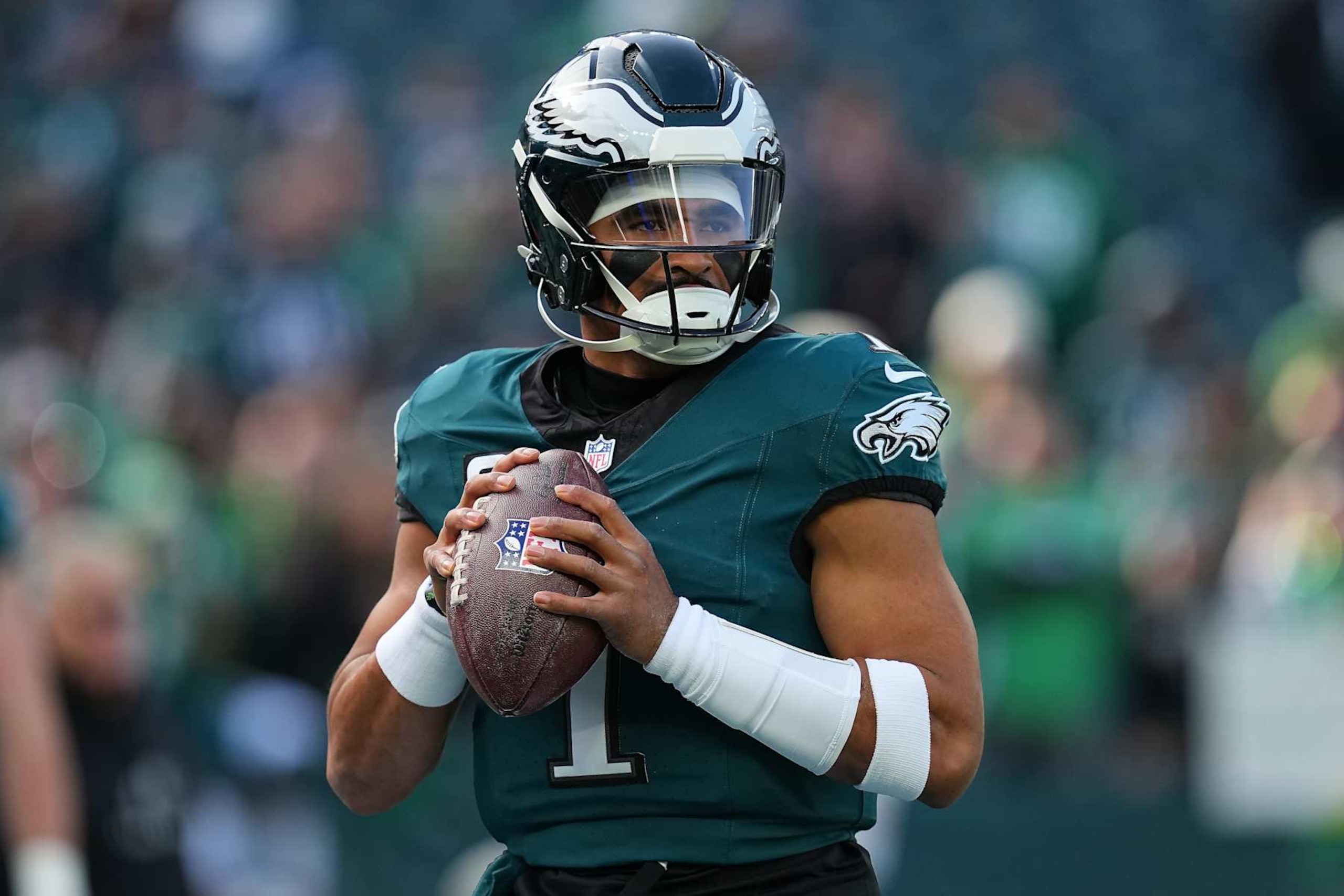 PHILADELPHIA, PENNSYLVANIA - DECEMBER 08: Jalen Hurts #1 of the Philadelphia Eagles warms up before a game against the Carolina Panthers at Lincoln Financial Field on December 08, 2024 in Philadelphia, Pennsylvania. (Photo by Mitchell Leff/Getty Images)