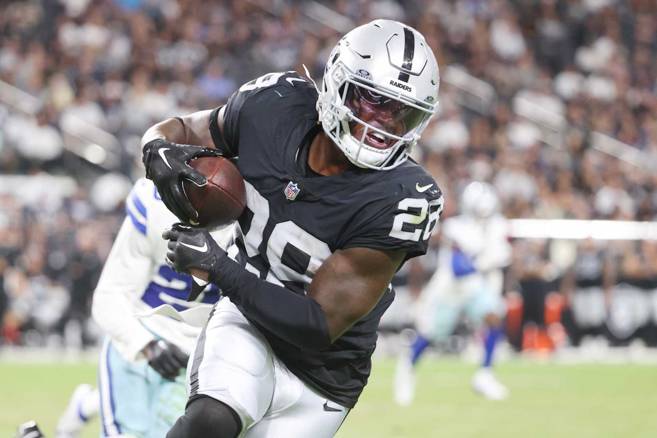 LAS VEGAS, NEVADA - AUGUST 17: Sincere McCormick #28 of the Las Vegas Raiders runs up field after a catch during the second half against the Dallas Cowboys during a preseason game at Allegiant Stadium on August 17, 2024 in Las Vegas, Nevada.  (Photo by Ian Maule/Getty Images)