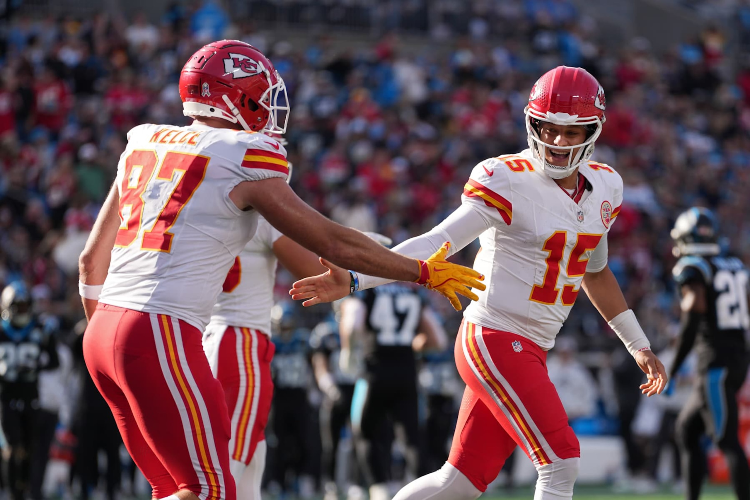CHARLOTTE, NORTH CAROLINA - NOVEMBER 24: Patrick Mahomes #15 celebrates with Travis Kelce #87 of the Kansas City Chiefs after a second quarter touchdown at Bank of America Stadium on November 24, 2024 in Charlotte, North Carolina. (Photo by Grant Halverson/Getty Images)