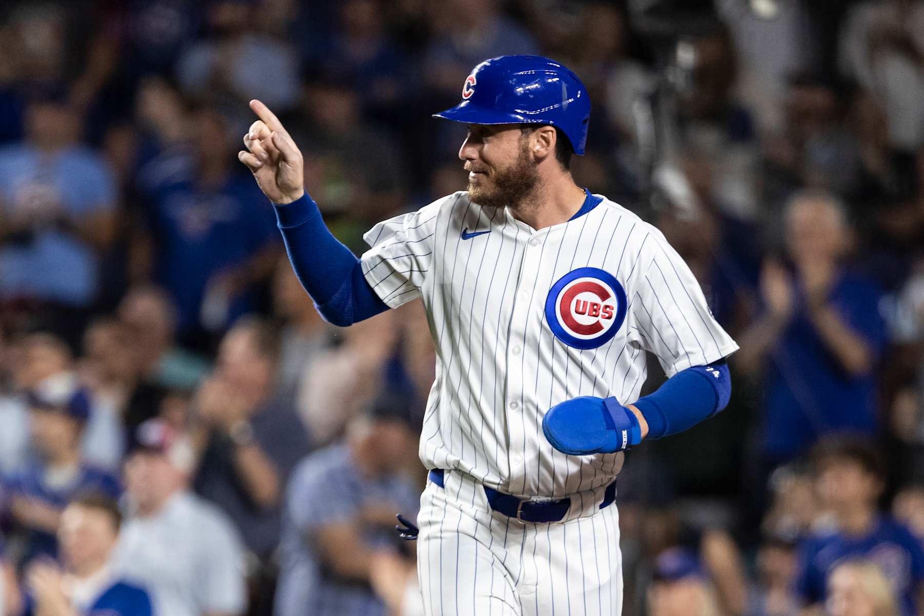 CHICAGO, ILLINOIS - SEPTEMBER 17: Cody Bellinger #24 of the Chicago Cubs points towards the field after scoring a run in the third inning against the Oakland Athletics at Wrigley Field on September 17, 2024 in Chicago, Illinois. (Photo by Griffin Quinn/Getty Images)