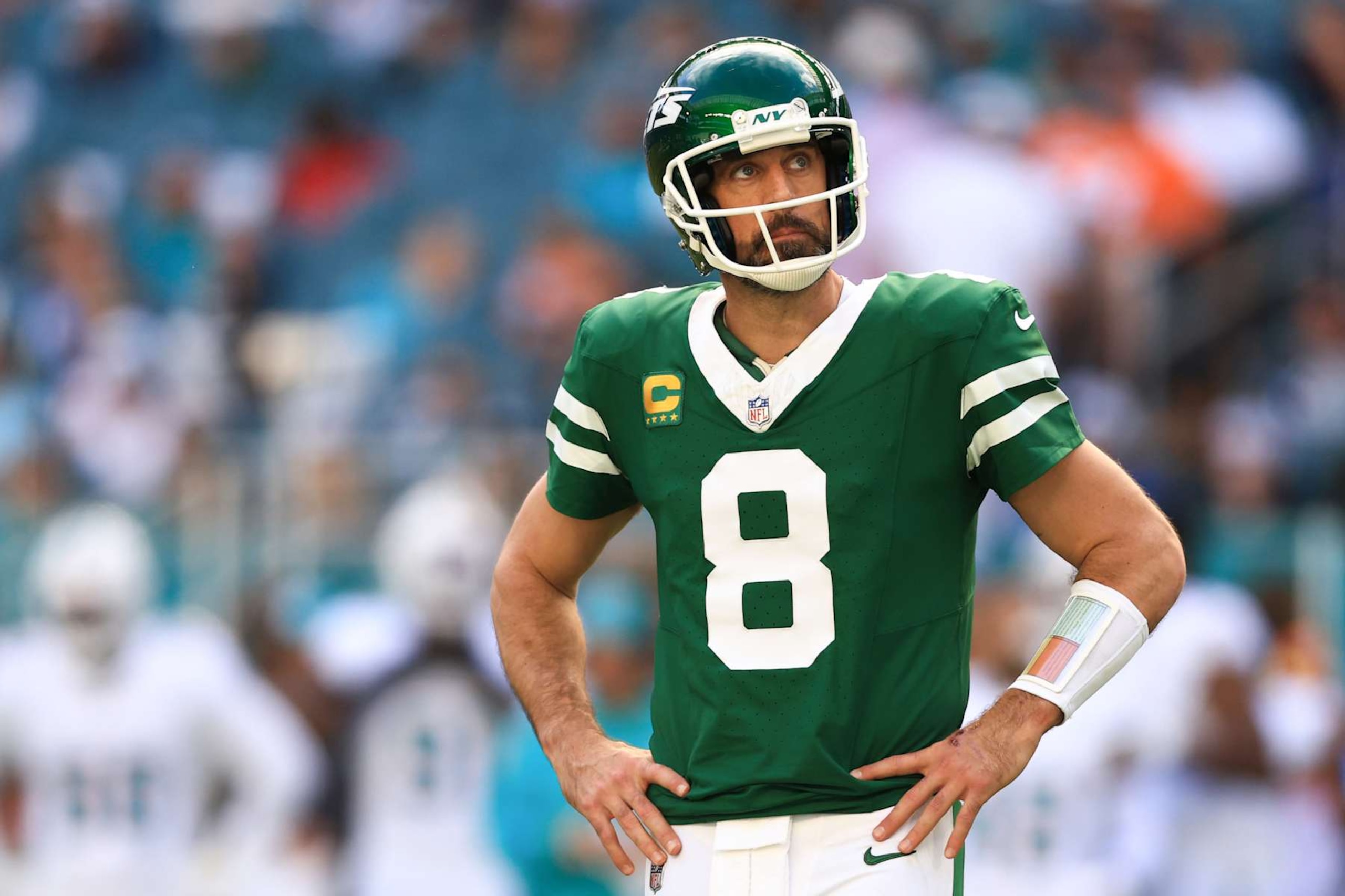 MIAMI GARDENS, FLORIDA - DECEMBER 08: Aaron Rodgers #8 of the New York Jets reacts on the field during the first half of the game against the Miami Dolphins at Hard Rock Stadium on December 08, 2024 in Miami Gardens, Florida. (Photo by Megan Briggs/Getty Images)
