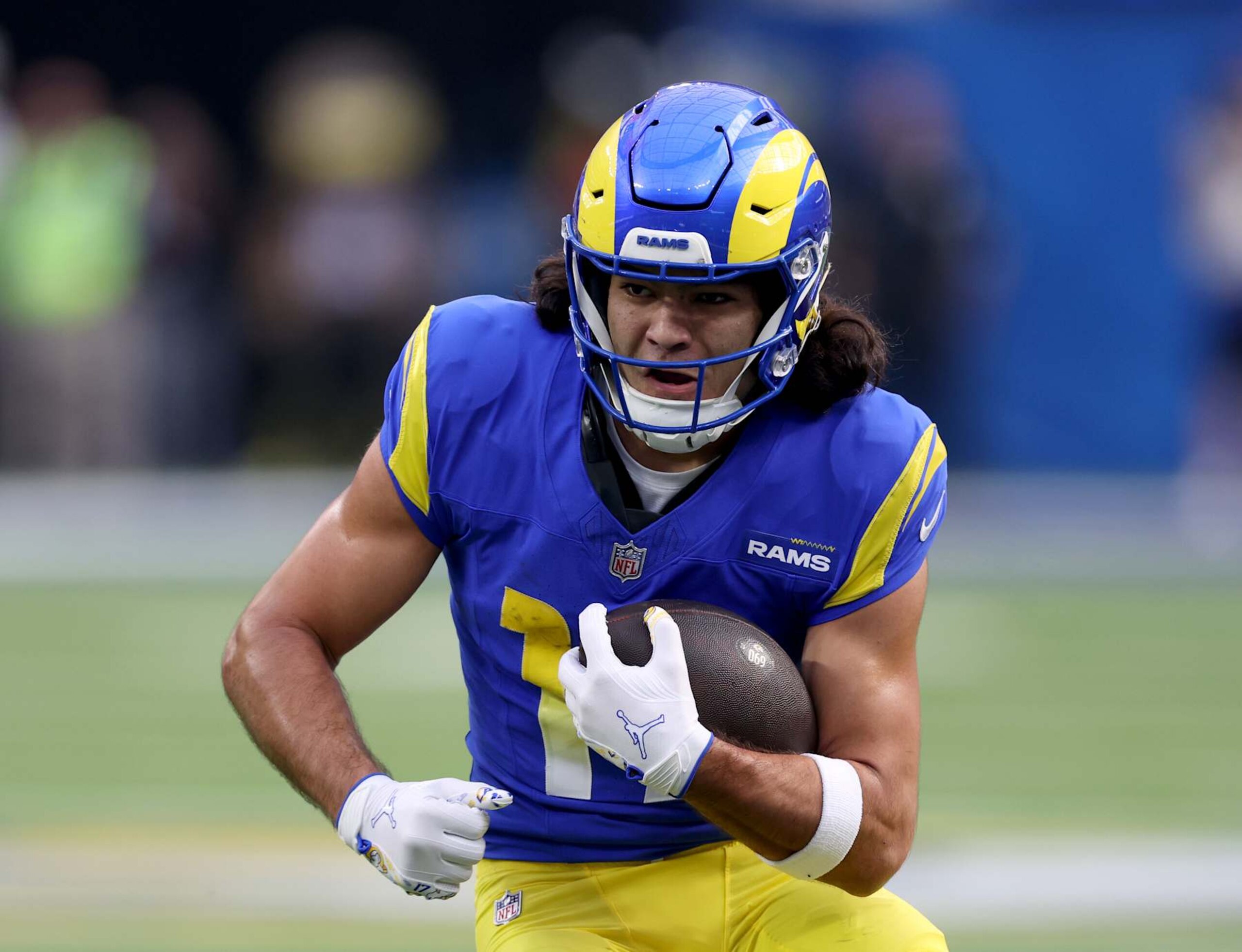 INGLEWOOD, CALIFORNIA - DECEMBER 08: Puka Nacua #17 of the Los Angeles Rams runs off of a handoff during a 44-42 win over the Buffalo Bills at SoFi Stadium on December 08, 2024 in Inglewood, California. (Photo by Harry How/Getty Images)
