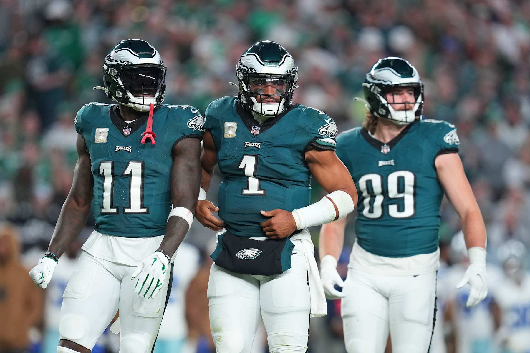 PHILADELPHIA, PENNSYLVANIA - NOVEMBER 5: A.J. Brown #11, Jalen Hurts #1, and Jack Stoll #89 of the Philadelphia Eagles look on against the Dallas Cowboys at Lincoln Financial Field on November 5, 2023 in Philadelphia, Pennsylvania. (Photo by Mitchell Leff/Getty Images)
