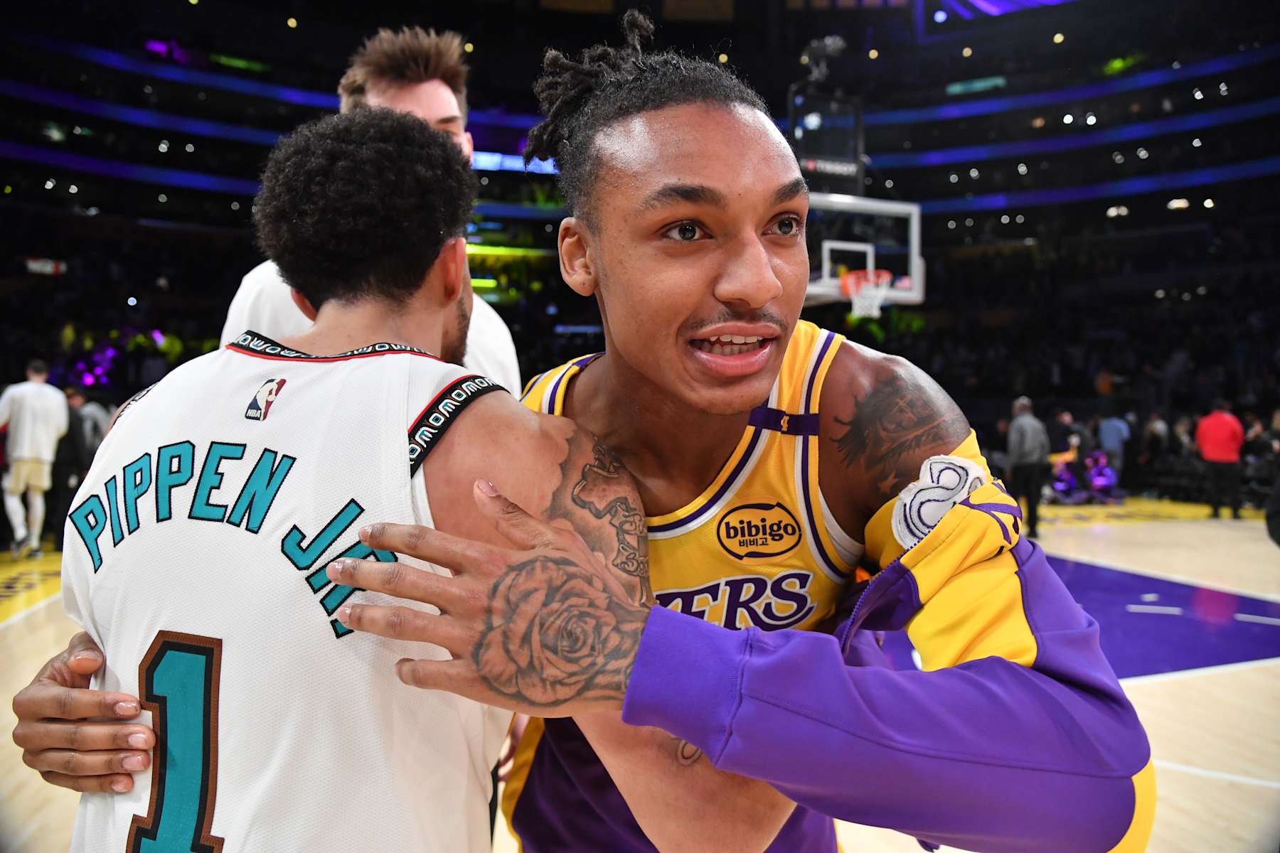 LOS ANGELES, CA - NOVEMBER 13: Scotty Pippen Jr. #1 of the Memphis Grizzlies and Maxwell Lewis #20 of the Los Angeles Lakers embrace after the game on November 13, 2024 at Crypto.com Arena in Los Angeles, California. NOTE TO USER: User expressly acknowledges and agrees that, by downloading and/or using this Photograph, user is consenting to the terms and conditions of the Getty Images License Agreement. Mandatory Copyright Notice: Copyright 2024 NBAE (Photo by Juan Ocampo/NBAE via Getty Images)