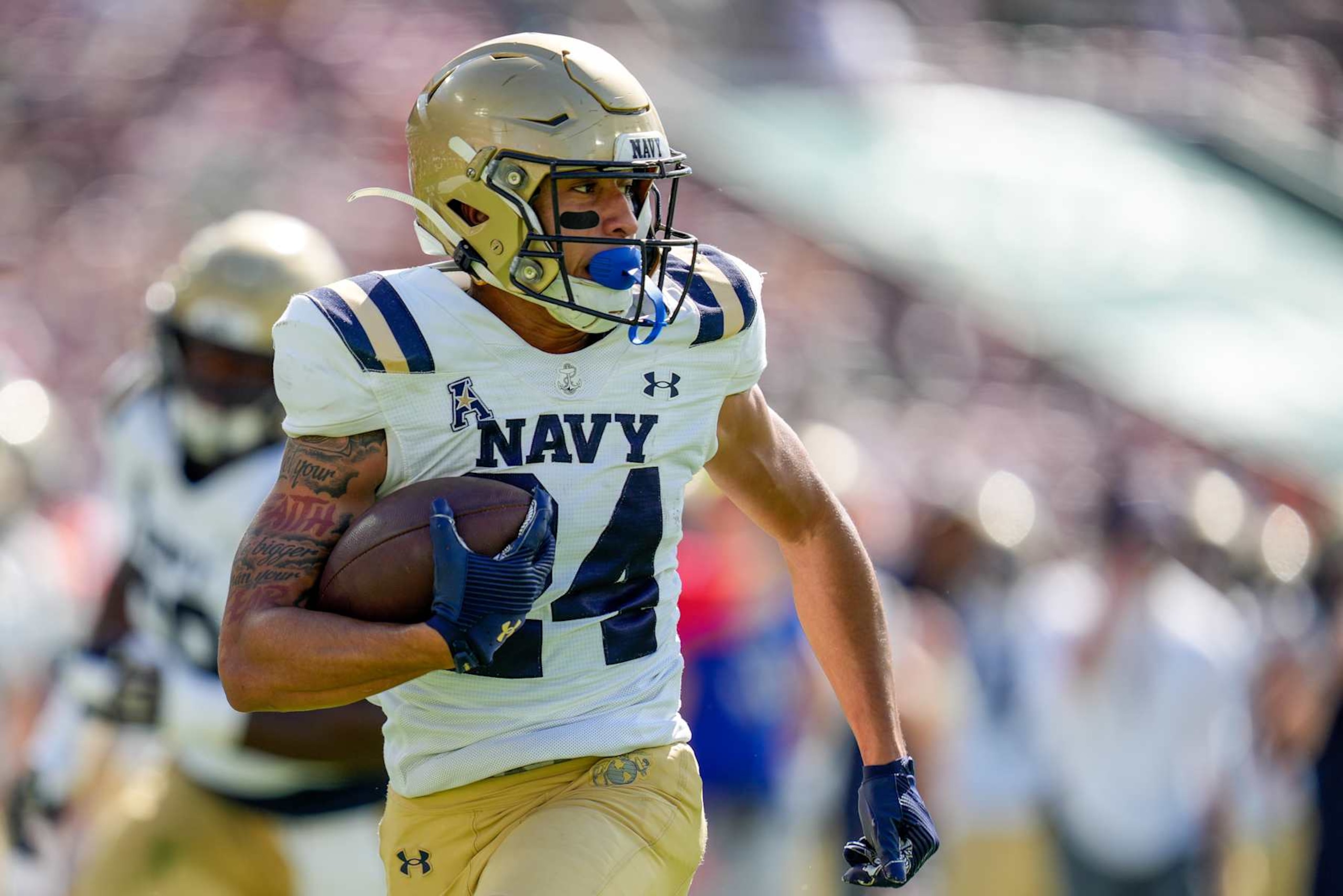 TAMPA, FL - NOVEMBER 09: Navy Midshipmen running back Brandon Chatman (24) runs ahead during a game between the Navy Midshipmen and the South Florida Bulls on November 9, 2024 at Raymond James Stadium in Tampa, FL. (Photo by Ricky Bowden/Icon Sportswire via Getty Images)