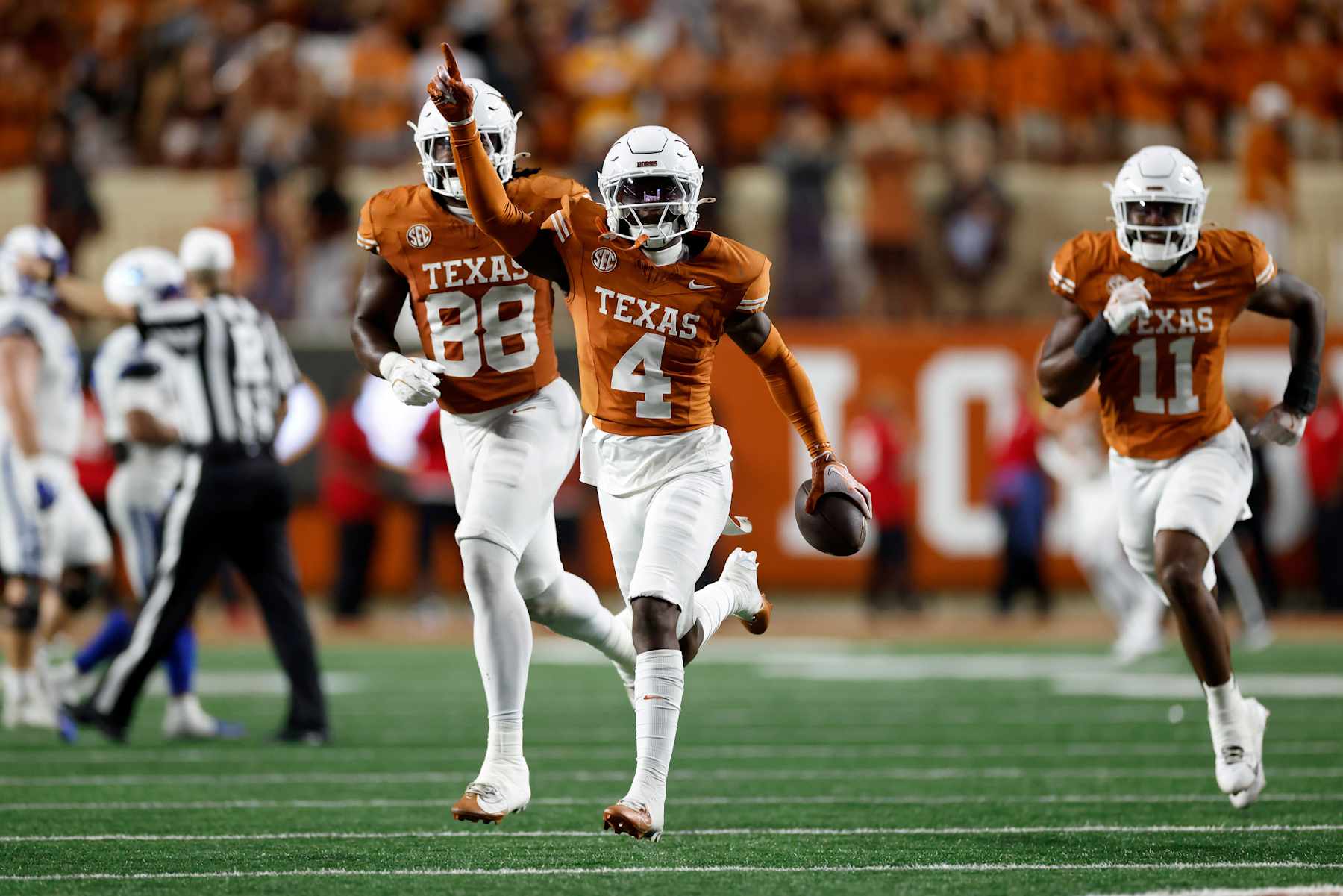 AUSTIN, TEXAS - NOVEMBER 23: Andrew Mukuba #4 of the Texas Longhorns celebrates after intercepting a pass in the second half against the Kentucky Wildcats at Darrell K Royal-Texas Memorial Stadium on November 23, 2024 in Austin, Texas. (Photo by Tim Warner/Getty Images)
