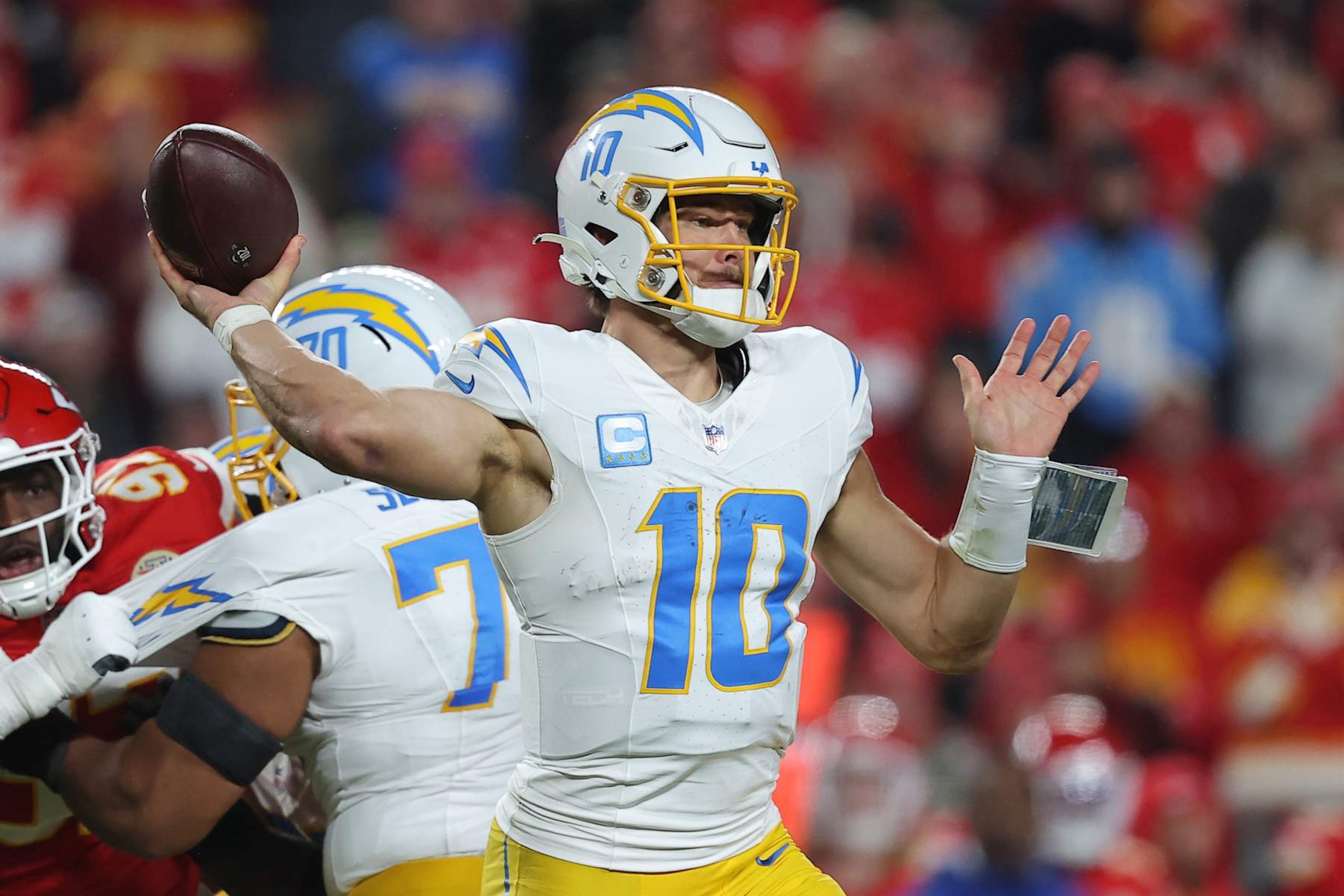 KANSAS CITY, MISSOURI - DECEMBER 08: Justin Herbert #10 of the Los Angeles Chargers throws a pass during the second quarter against the Kansas City Chiefs at GEHA Field at Arrowhead Stadium on December 08, 2024 in Kansas City, Missouri. (Photo by David Eulitt/Getty Images)