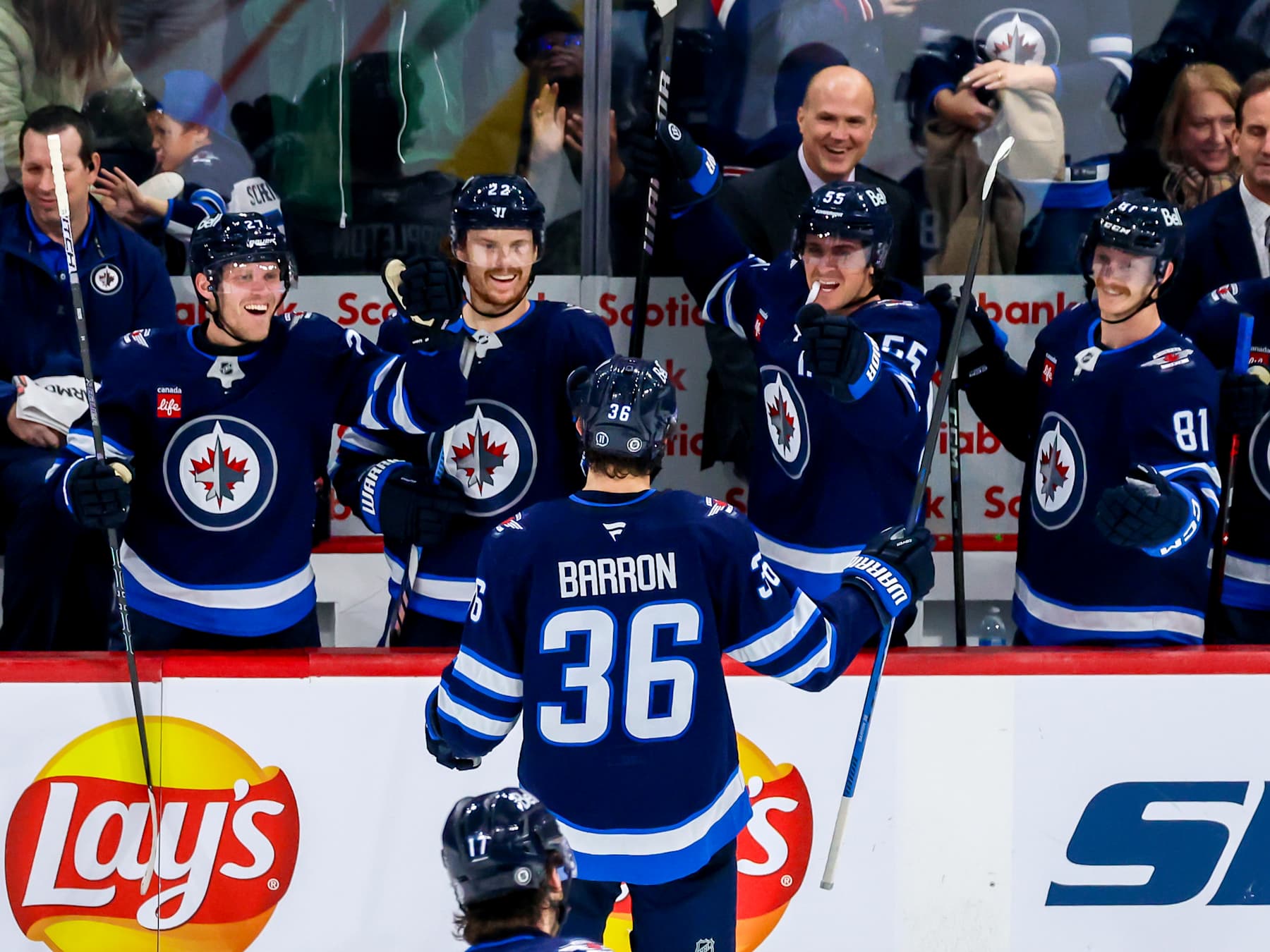 WINNIPEG, CANADA - NOVEMBER 19: Morgan Barron #36 of the Winnipeg Jets celebrates his second goal of the game with teammates Nikolaj Ehlers #27, Mason Appleton #22, Mark Scheifele #55, and Kyle Connor #81 during third period action against the Florida Panthers at Canada Life Centre on November 19, 2024 in Winnipeg, Manitoba, Canada. (Photo by Jonathan Kozub/NHLI via Getty Images)