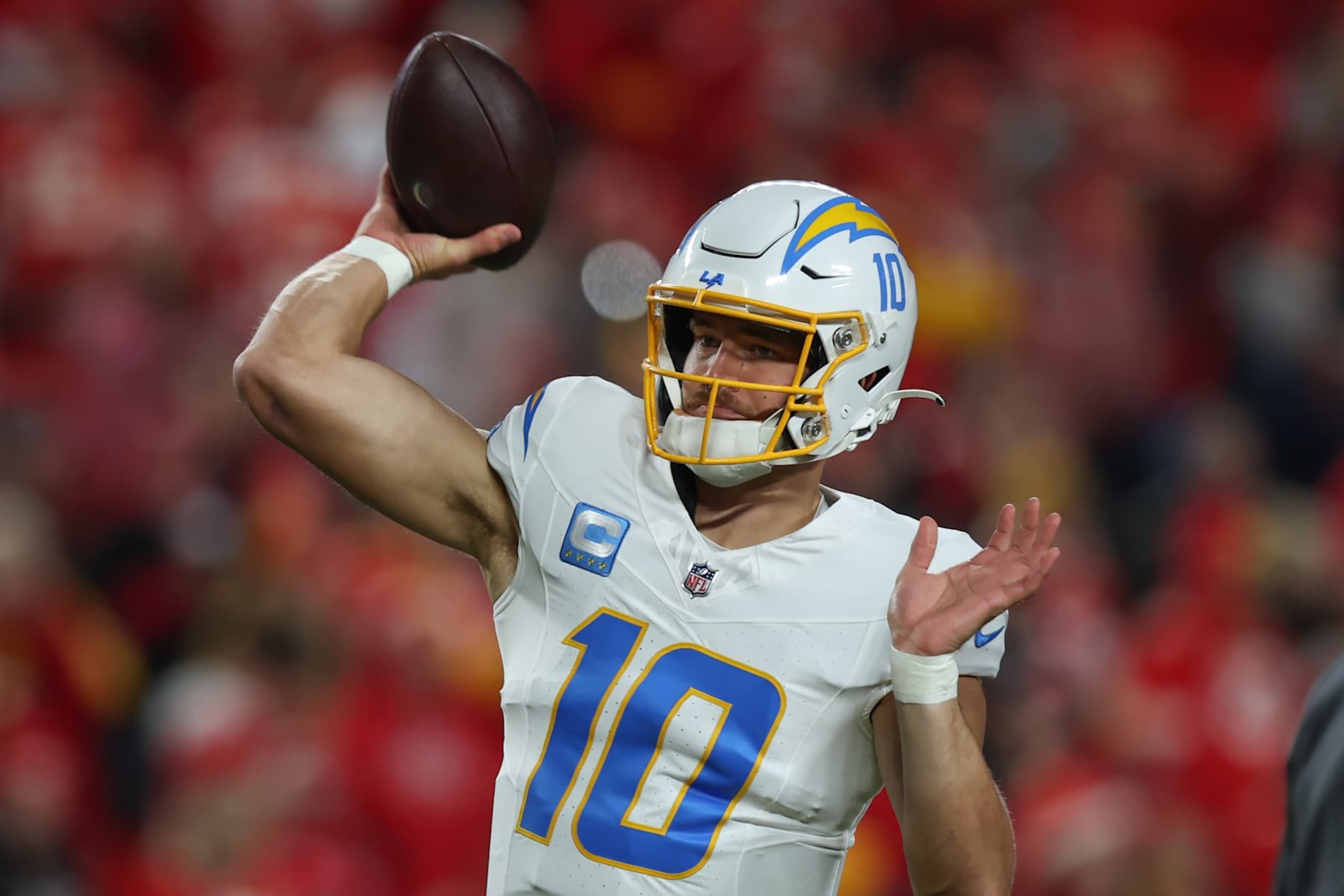 KANSAS CITY, MO - DECEMBER 08: Los Angeles Chargers quarterback Justin Herbert (10) throws a pass before an NFL game between the Los Angeles Chargers and Kansas City Chiefs on December 8, 2024 at GEHA Field at Arrowhead Stadium in Kansas City, MO. (Photo by Scott Winters/Icon Sportswire via Getty Images)