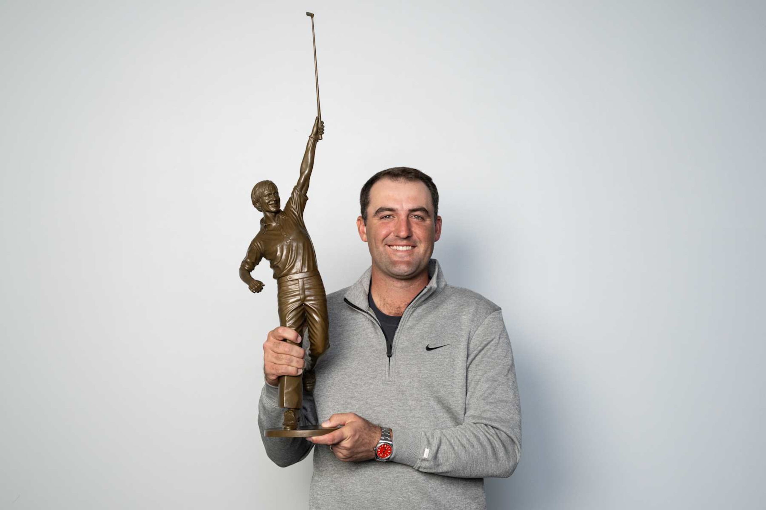 PLANO, TEXAS - DECEMBER 10: Scottie Scheffler holds the Jack Nicklaus Award for Player of the Year, on December 10, 2024 in Plano, Texas. (Photo by Ben Jared/PGA TOUR via Getty Images)