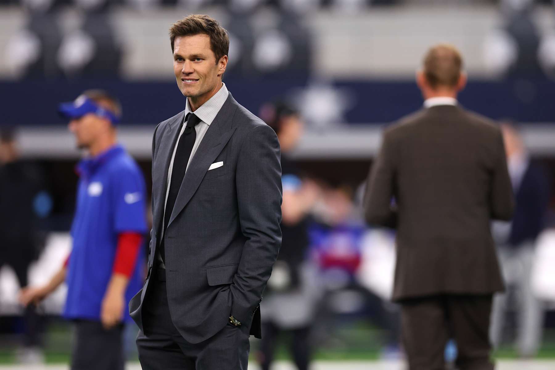 ARLINGTON, TEXAS - NOVEMBER 28: Tom Brady looks on prior to the game between the Dallas Cowboys and the New York Giants at AT&T Stadium on November 28, 2024 in Arlington, Texas. (Photo by Sam Hodde/Getty Images)