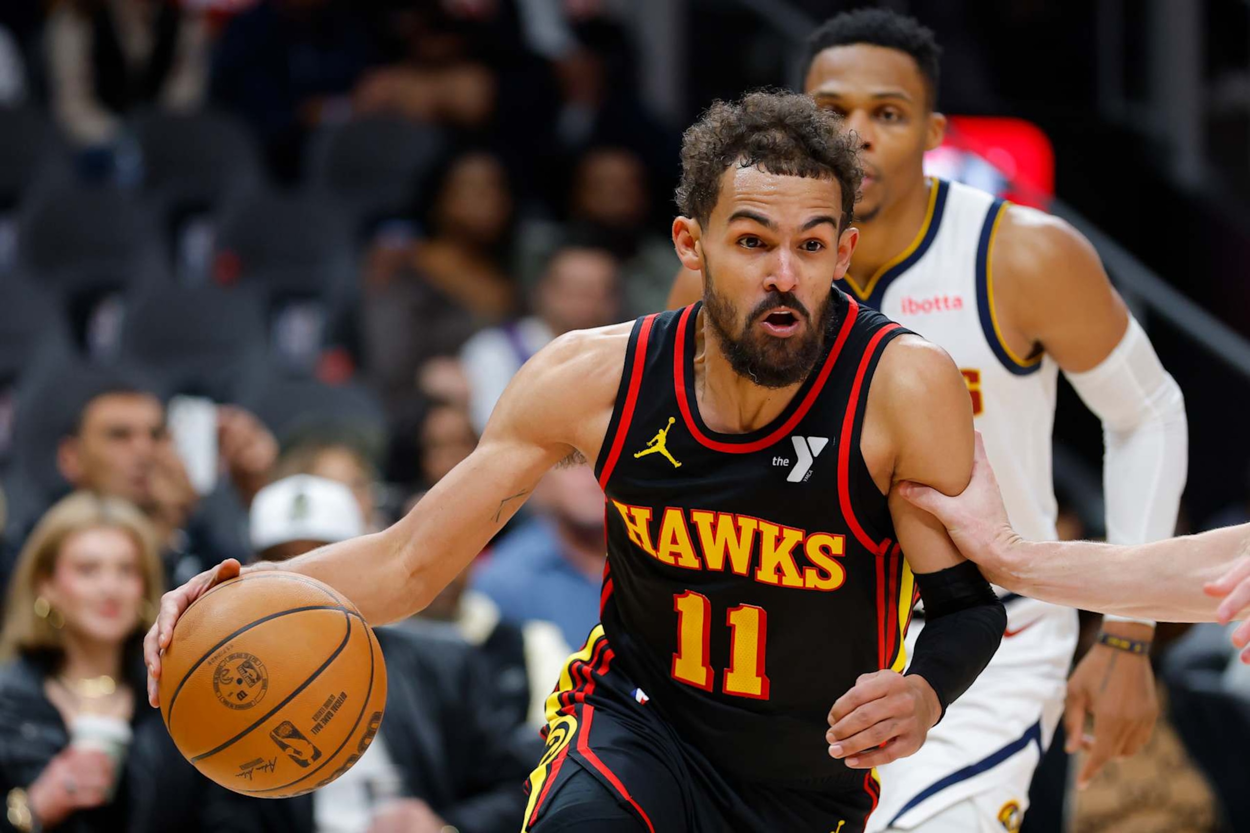 ATLANTA, GEORGIA - DECEMBER 08: Trae Young #11 of the Atlanta Hawks drives to the basket against the Denver Nuggets during the fourth quarter at State Farm Arena on December 8, 2024 in Atlanta, Georgia. NOTE TO USER: User expressly acknowledges and agrees that, by downloading and or using this photograph, User is consenting to the terms and conditions of the Getty Images License Agreement. (Photo by Todd Kirkland/Getty Images)