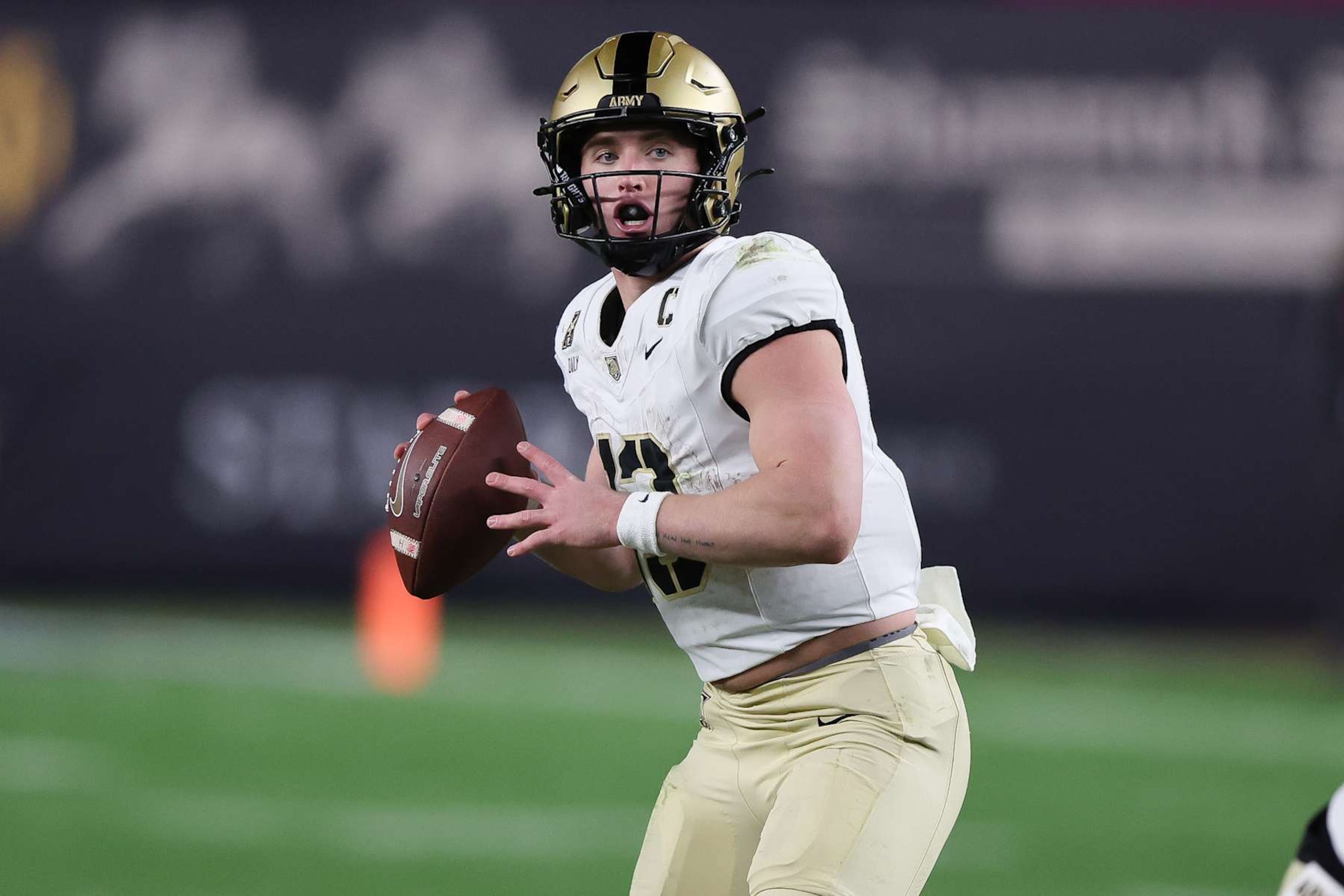 BRONX, NY - NOVEMBER 23: Army Black Knights quarterback Bryson Daily (13) drops back during a game between Army Black Knights and Notre Dame Fighting Irish on November 23, 2024 at Yankee Stadium in the Bronx, New York.(Photo by Andrew Mordzynski/Icon Sportswire via Getty Images)