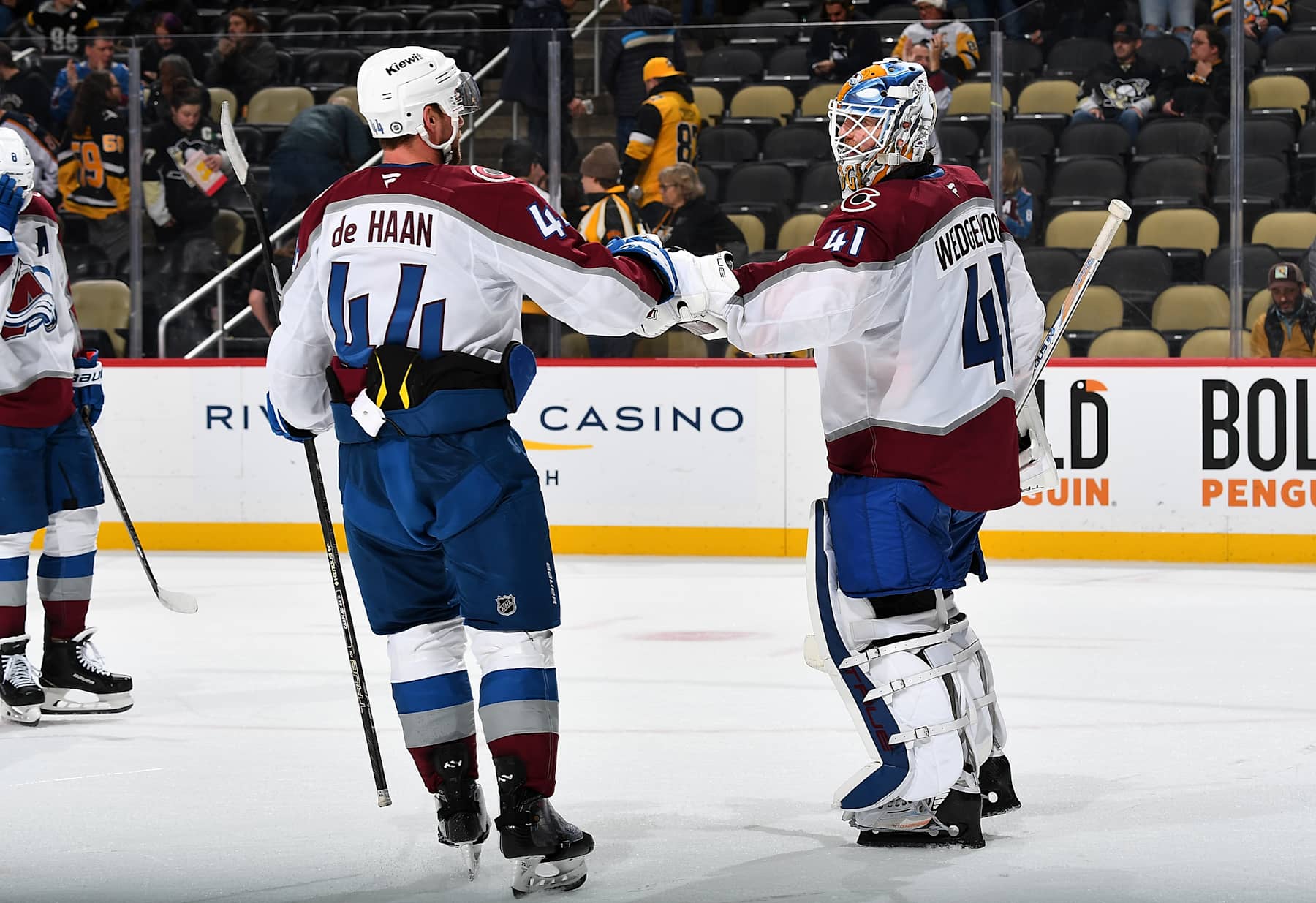 PITTSBURGH, PA - DECEMBER 10:  Scott Wedgewood #41 celebrates with Calvin de Haan #44 of the Colorado Avalanche after a 6-2 win over the Pittsburgh Penguins at PPG PAINTS Arena on December 10, 2024 in Pittsburgh, Pennsylvania. (Photo by Joe Sargent/NHLI via Getty Images)