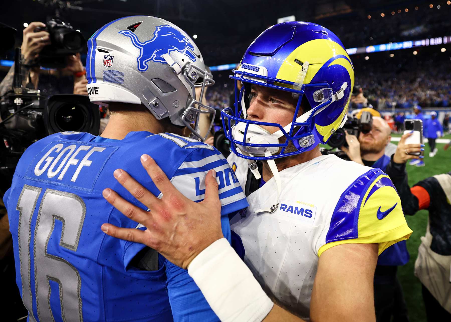 DETROIT, MI - JANUARY 14: Jared Goff #16 of the Detroit Lions shakes hands with Matthew Stafford #9 of the Los Angeles Rams after an NFL wild-card playoff football game at Ford Field on January 14, 2024 in Detroit, Michigan. (Photo by Kevin Sabitus/Getty Images)