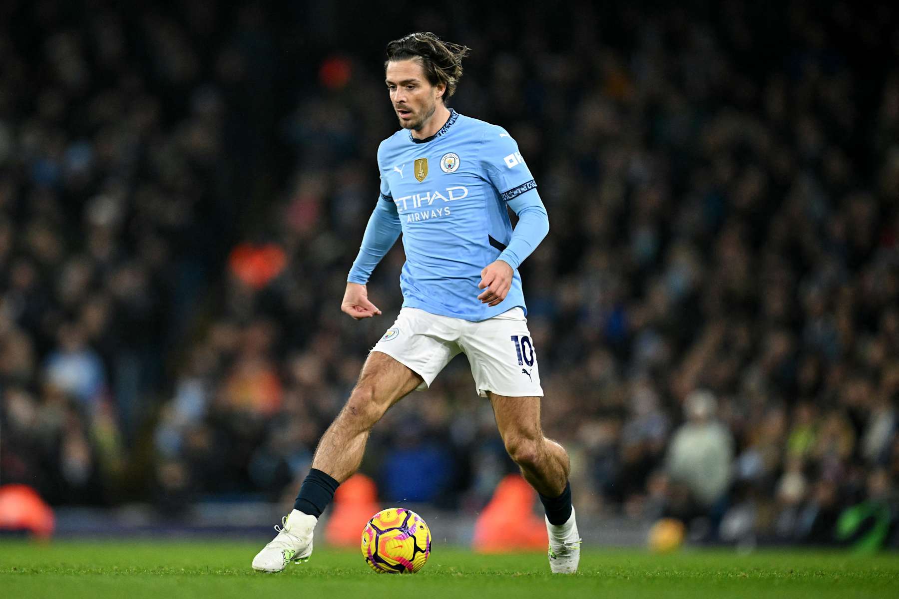 Manchester City's English midfielder #10 Jack Grealish runs with the ball during the English Premier League football match between Manchester City and Nottingham Forest at the Etihad Stadium in Manchester, north west England, on December 4, 2024. (Photo by Oli SCARFF / AFP) / RESTRICTED TO EDITORIAL USE. No use with unauthorized audio, video, data, fixture lists, club/league logos or 'live' services. Online in-match use limited to 120 images. An additional 40 images may be used in extra time. No video emulation. Social media in-match use limited to 120 images. An additional 40 images may be used in extra time. No use in betting publications, games or single club/league/player publications. /  (Photo by OLI SCARFF/AFP via Getty Images)