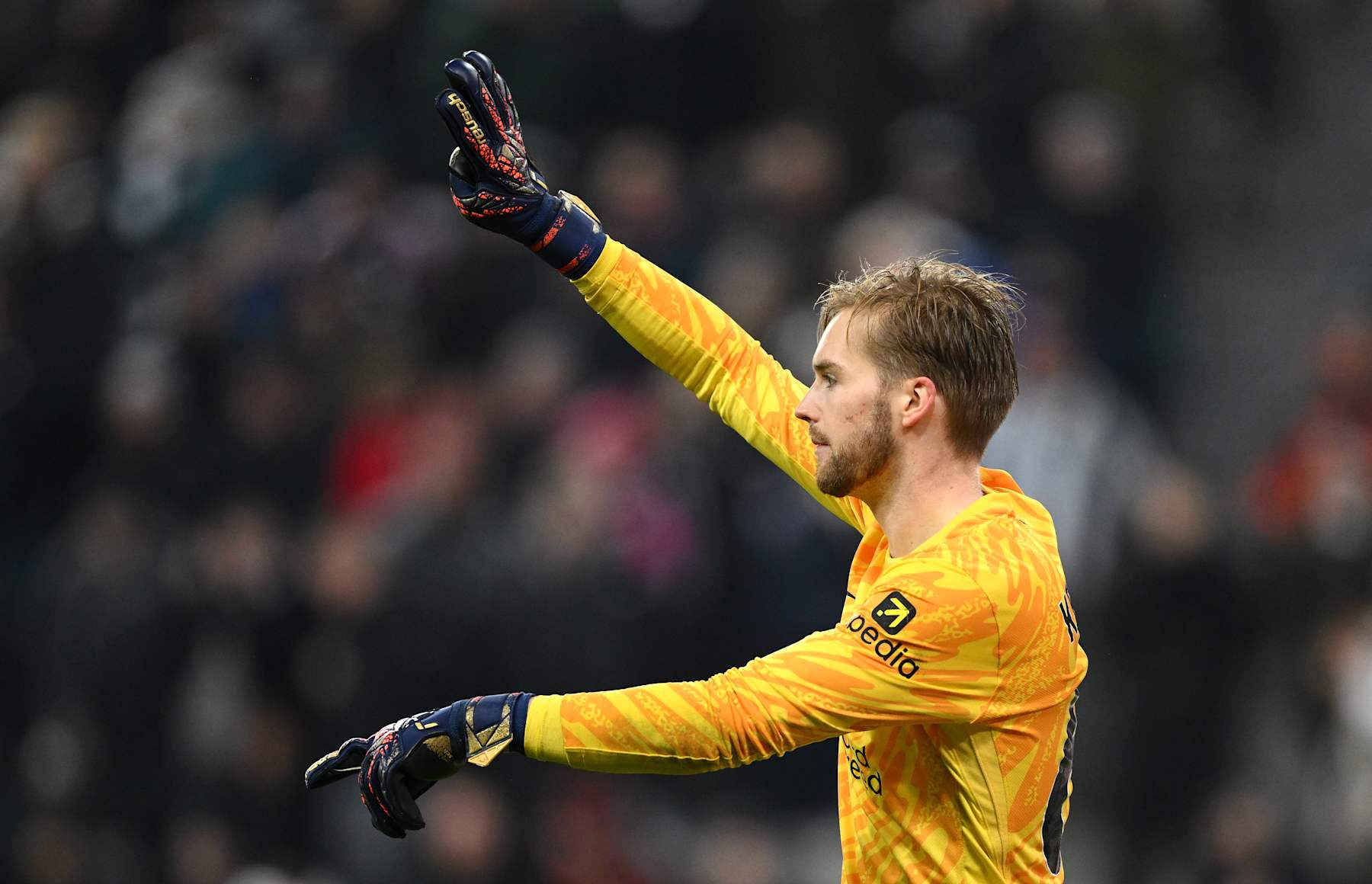 NEWCASTLE UPON TYNE, ENGLAND - DECEMBER 04: Liverpool goalkeeper Caoimhin Kelleher reacts during the Premier League match between Newcastle United FC and Liverpool FC at St James' Park on December 04, 2024 in Newcastle upon Tyne, England. (Photo by Stu Forster/Getty Images)