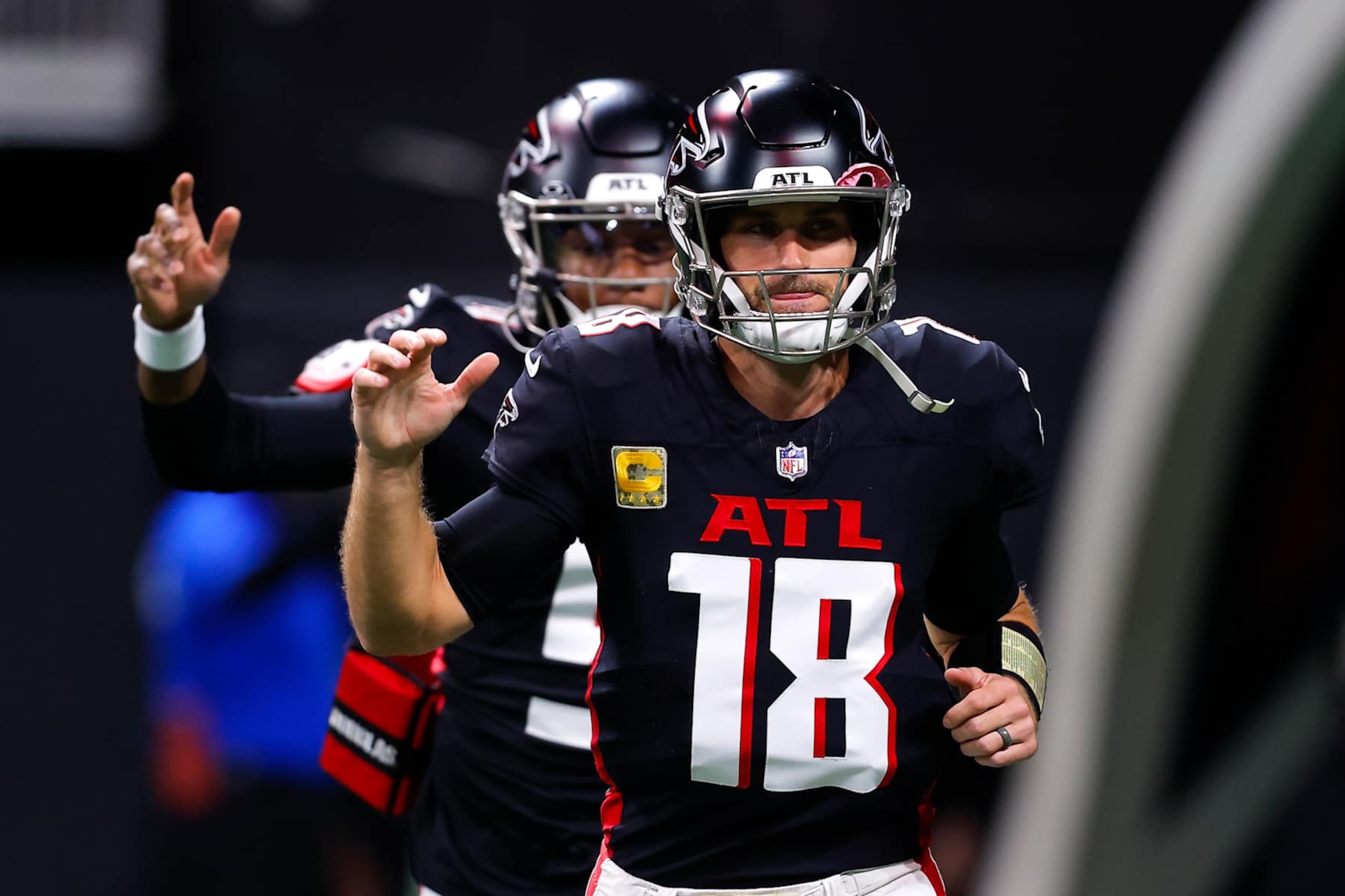 Falcons QBs Kirk Cousins (front) and Michael Penix Jr.  (back)