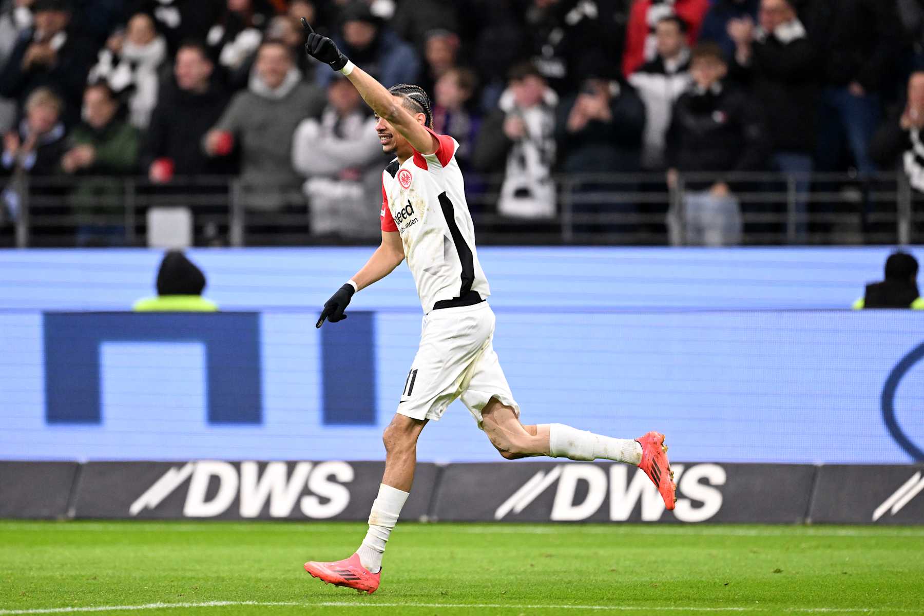 Frankfurt's French forward #11 Hugo Ekitike celebrates after scoring the 1-0 goal during the German first division Bundesliga football match between Eintracht Frankfurt and Augsburg in Frankfurt am Main, western Germany, on December 7, 2024. (Photo by Kirill KUDRYAVTSEV / AFP) / DFL REGULATIONS PROHIBIT ANY USE OF PHOTOGRAPHS AS IMAGE SEQUENCES AND/OR QUASI-VIDEO (Photo by KIRILL KUDRYAVTSEV/AFP via Getty Images)