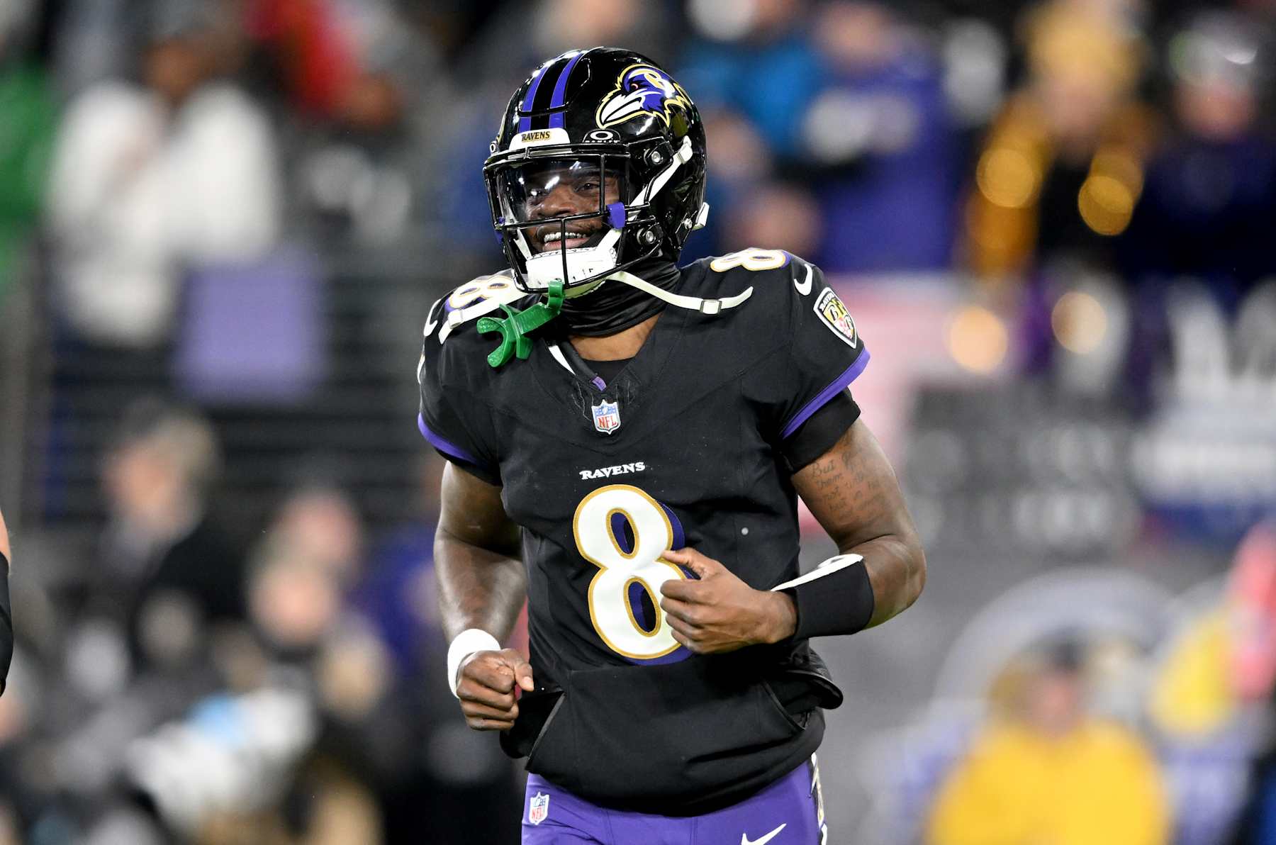 BALTIMORE, MARYLAND - DECEMBER 01: Lamar Jackson #8 of the Baltimore Ravens reacts to a play during the game against the Philadelphia Eagles at M&T Bank Stadium on December 01, 2024 in Baltimore, Maryland. (Photo by G Fiume/Getty Images)