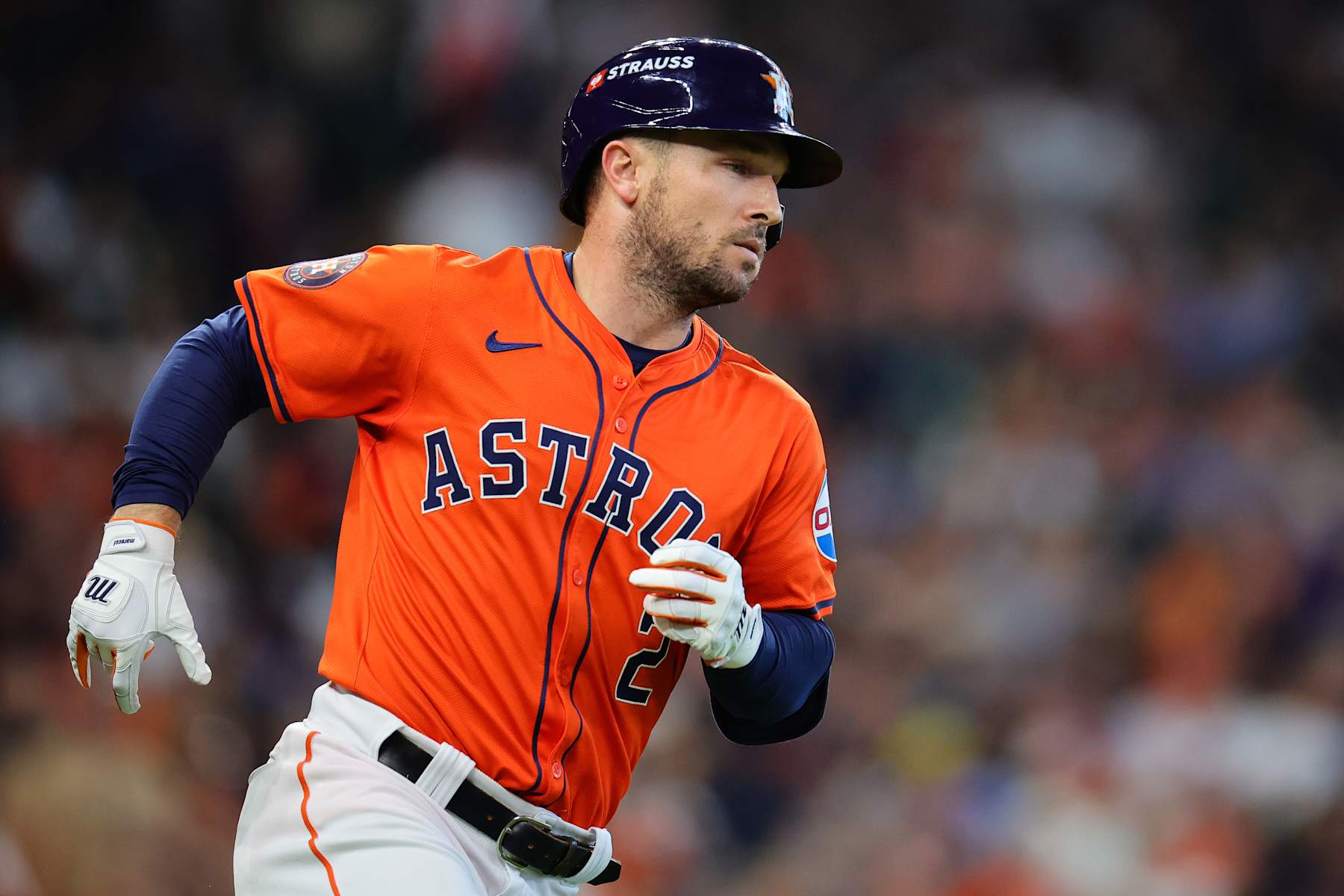 HOUSTON, TEXAS - OCTOBER 02: Alex Bregman #2 of the Houston Astros runs to first base after hitting a single against the Detroit Tigers in the second inning during Game Two of the Wild Card Series at Minute Maid Park on October 02, 2024 in Houston, Texas.  (Photo by Alex Slitz/Getty Images)