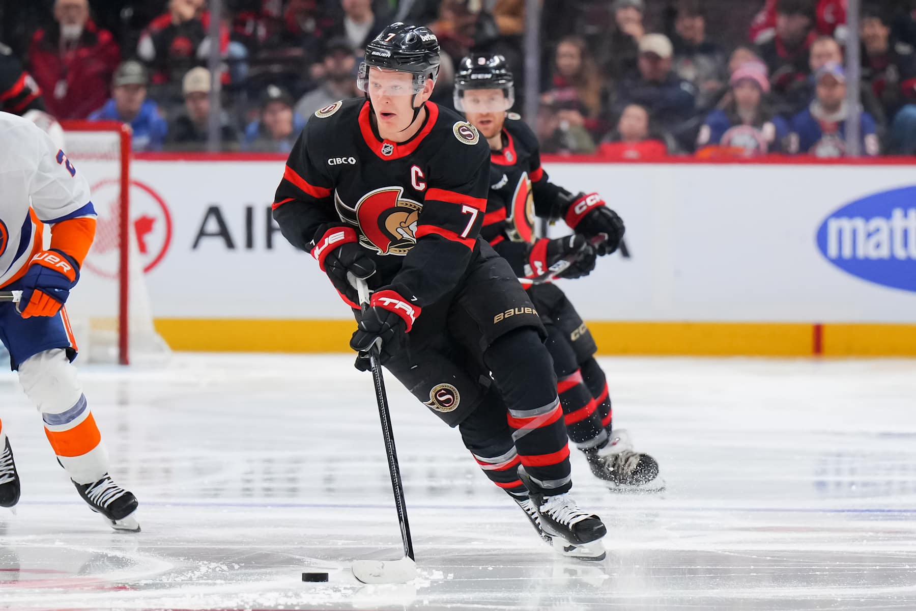 OTTAWA, CANADA - DECEMBER 8:  Brady Tkachuk #7 of the Ottawa Senators skates against the New York Islanders at Canadian Tire Centre on December 8, 2024 in Ottawa, Ontario, Canada.  (Photo by André Ringuette/NHLI via Getty Images)