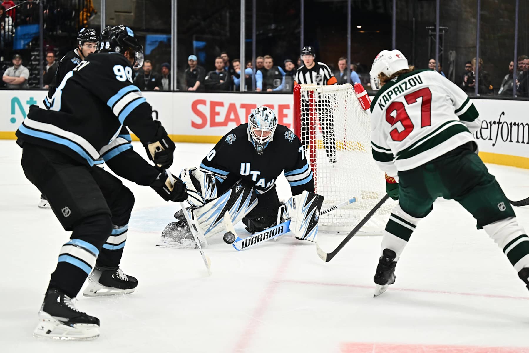 SALT LAKE CITY, UTAH - DECEMBER 10: Goaltender Karel Vejmelka #70 of the Utah Hockey Club blocks a shot taken by Kirill Kaprizov #97 of the Minnesota Wild during the overtime period of a game on December 10, 2024 at Delta Center in Salt Lake City, Utah.  (Photo by Jamie Sabau/NHLI via Getty Images)