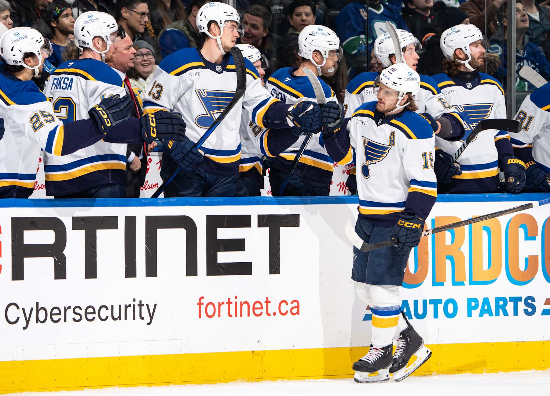VANCOUVER, CANADA - DECEMBER 10: Robert Thomas #18 of the St. Louis Blues celebrates his goal with teammates during the first period of their NHL game against the Vancouver Canucks at Rogers Arena on December 10, 2024 in Vancouver, British Columbia, Canada.  (Photo by Jeff Vinnick/NHLI via Getty Images)