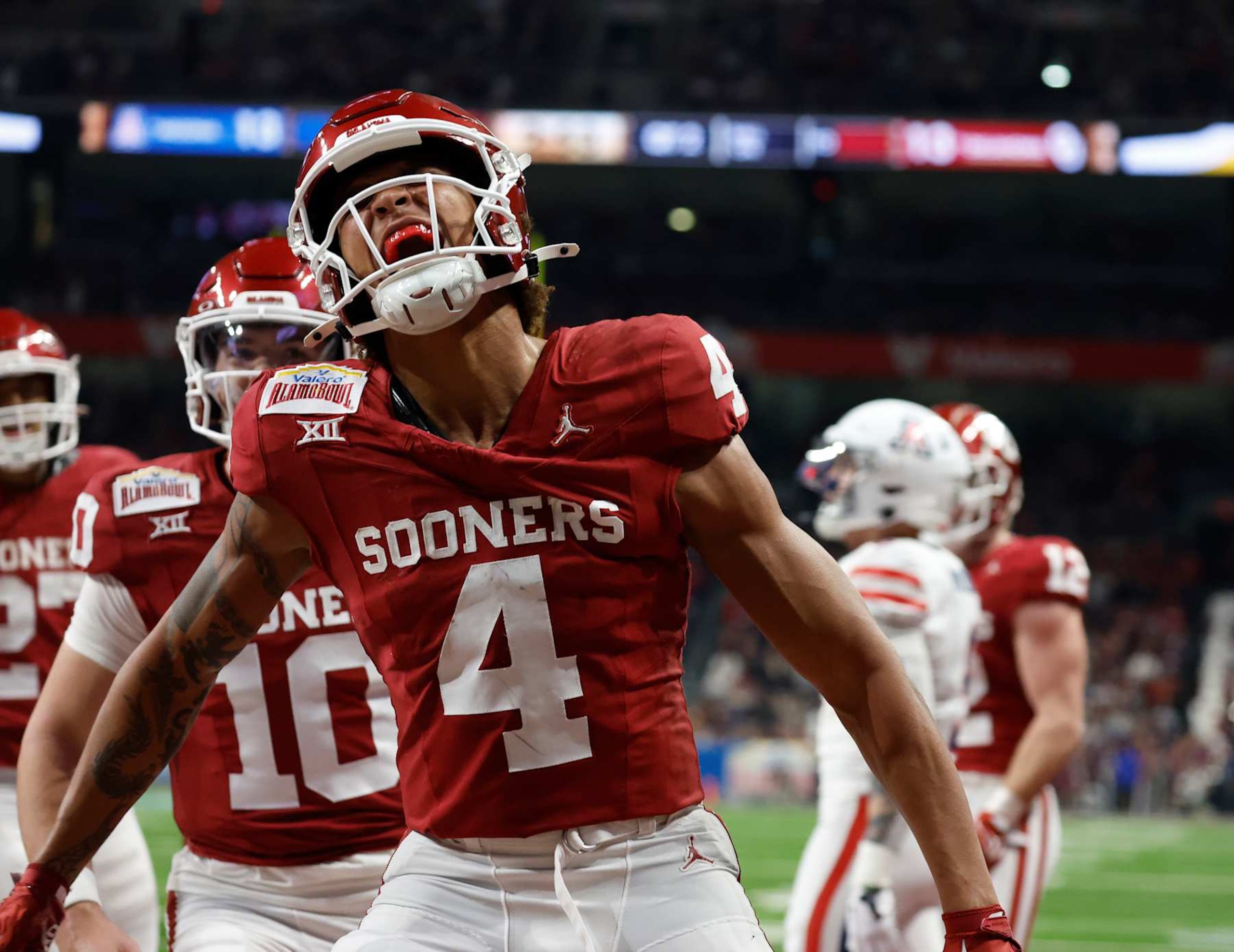 SAN ANTONIO, TX - DECEMBER 28:  Nic Anderson #4 of the Oklahoma Sooners celebrates his touchdown reception against the Arizona Wildcats in the first half at the Valero Alamo Bowl at the Alamodome on December  28, 2023 in San Antonio, Texas.  (Photo by Ronald Cortes/Getty Images)