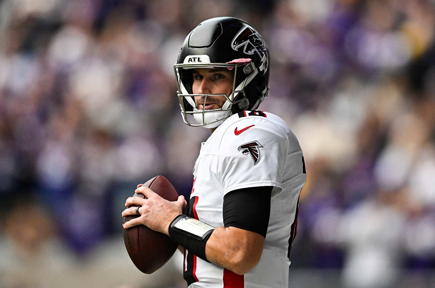MINNEAPOLIS, MINNESOTA - DECEMBER 8: Quarterback Kirk Cousins #18 of the Atlanta Falcons warms up of the game against the Minnesota Vikings at U.S. Bank Stadium on December 8, 2024 in Minneapolis, Minnesota. The Vikings defeated the Falcons 42-21. (Photo by Stephen Maturen/Getty Images)