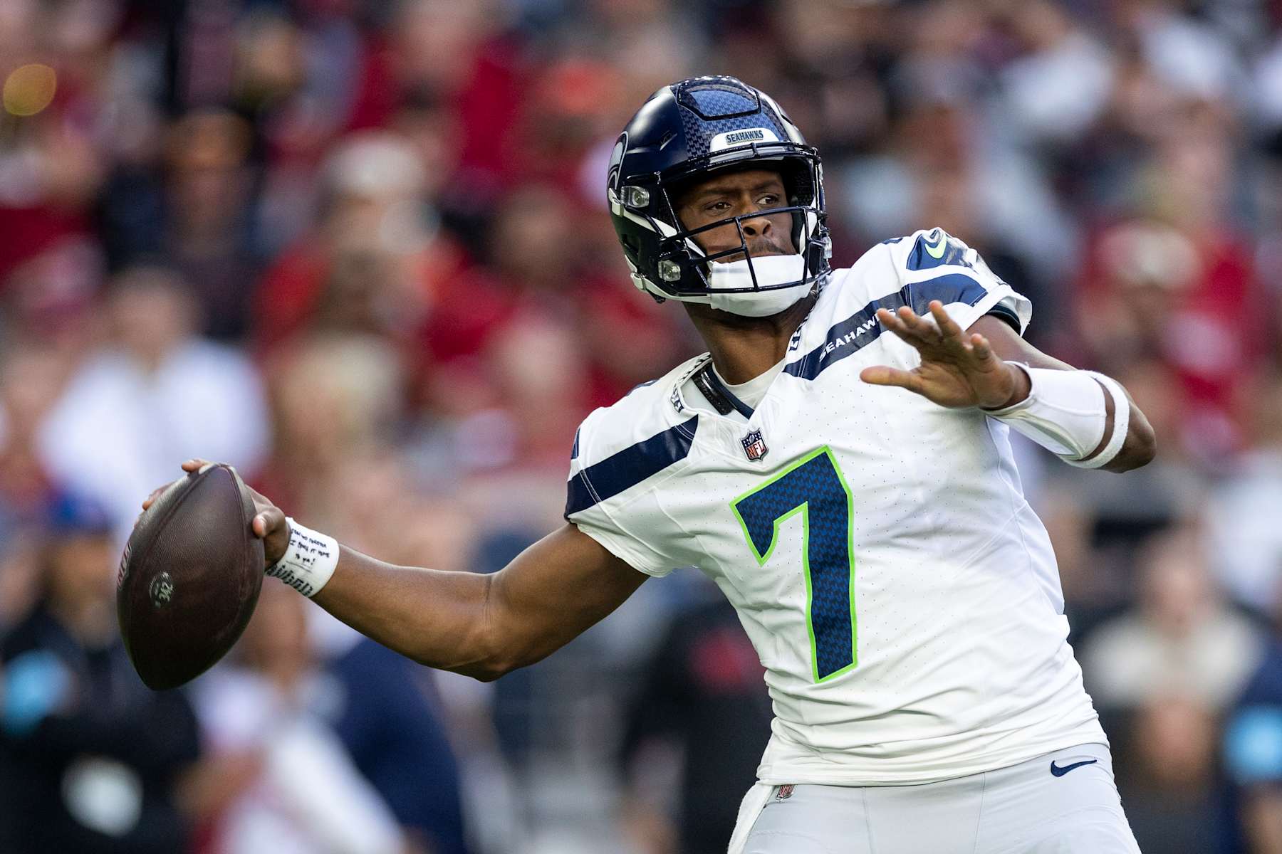 GLENDALE, ARIZONA - DECEMBER 8: Geno Smith #7 of the Seattle Seahawks looks to pass during an NFL Football game against the Arizona Cardinals at State Farm Stadium on December 08, 2024 in Glendale, Arizona. (Photo by Michael Owens/Getty Images)