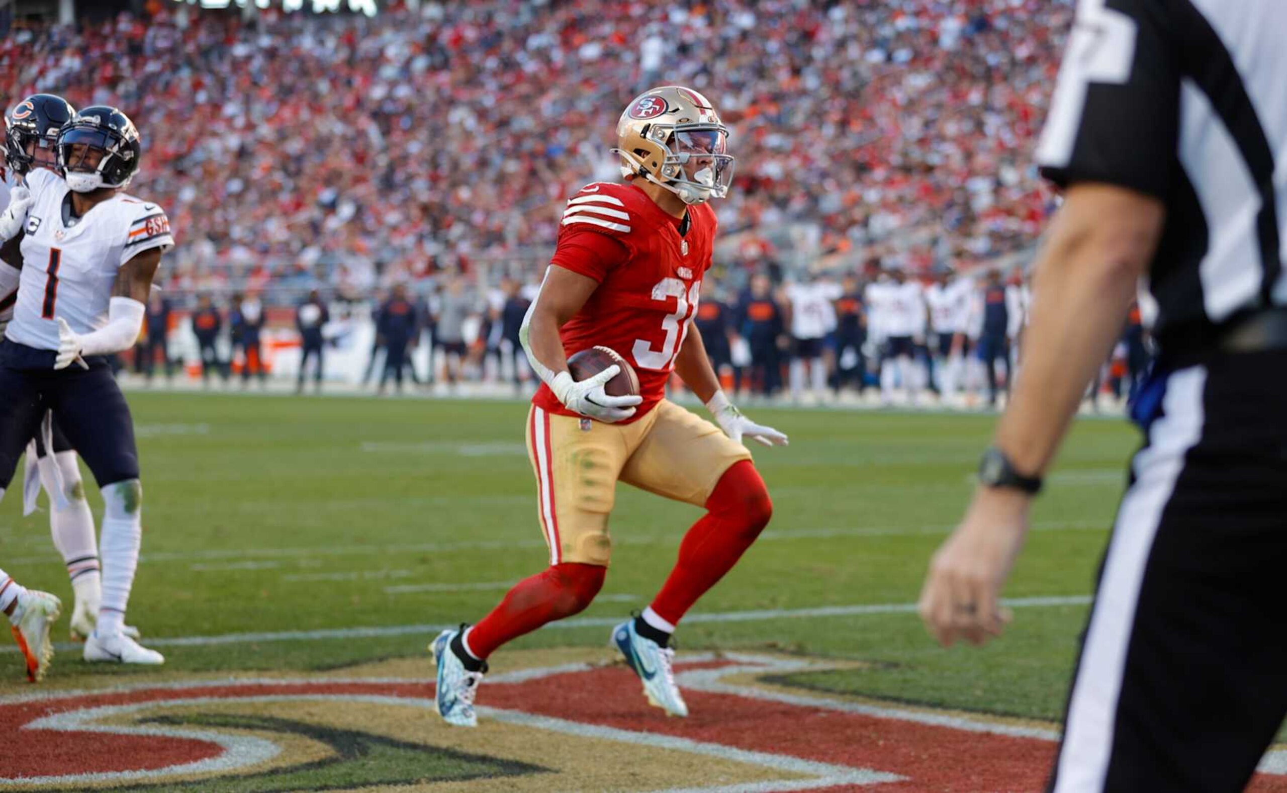 SANTA CLARA, CA - DECEMBER 8: Isaac Guerendo #31 of the San Francisco 49ers rushes for a 4-yard touchdown during the game against the Chicago Bears at Levi's Stadium on December 8, 2024 in Santa Clara, California. The 49ers defeated the Bears 38-13. (Photo by Michael Zagaris/San Francisco 49ers/Getty Images)