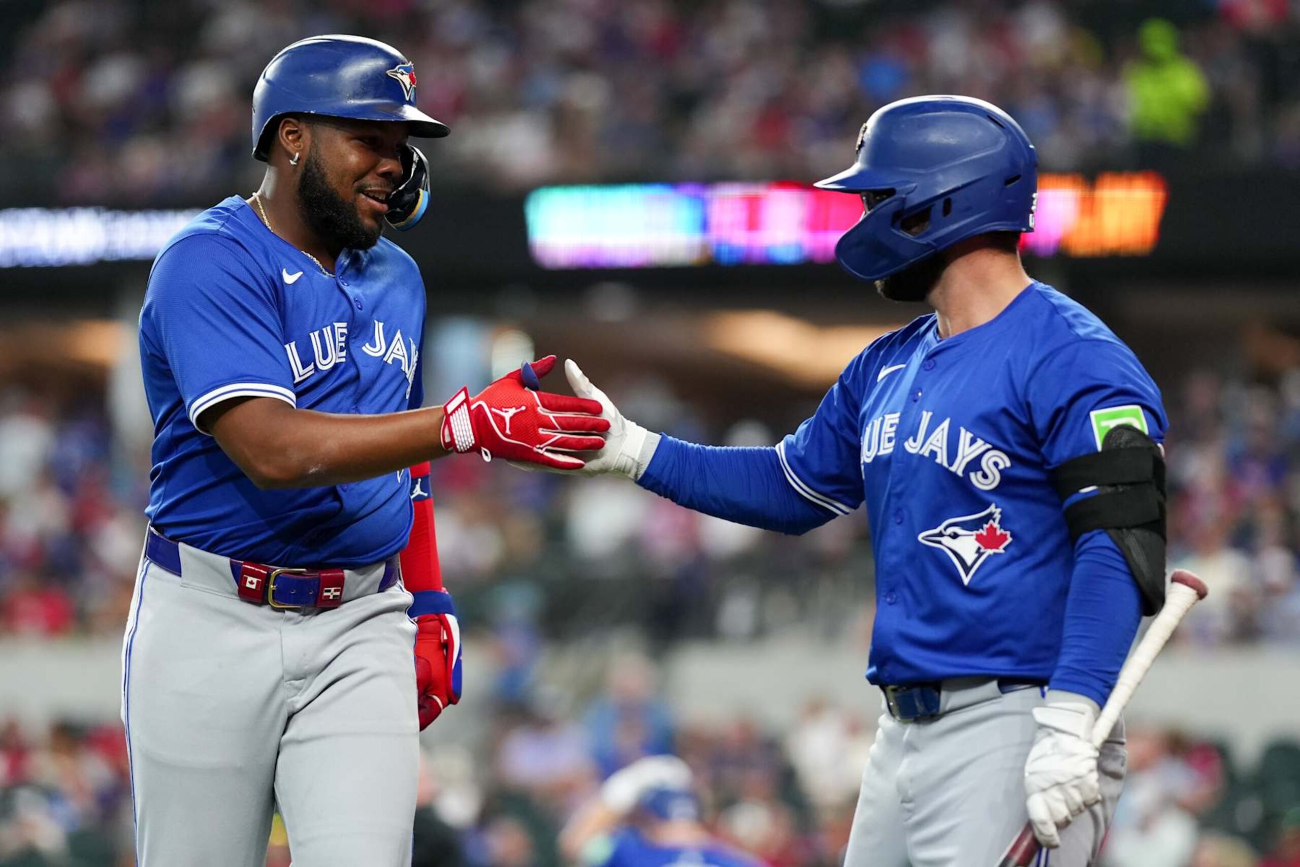 Vladimir Guerrero Jr. (L) and Davis Schneider (R)