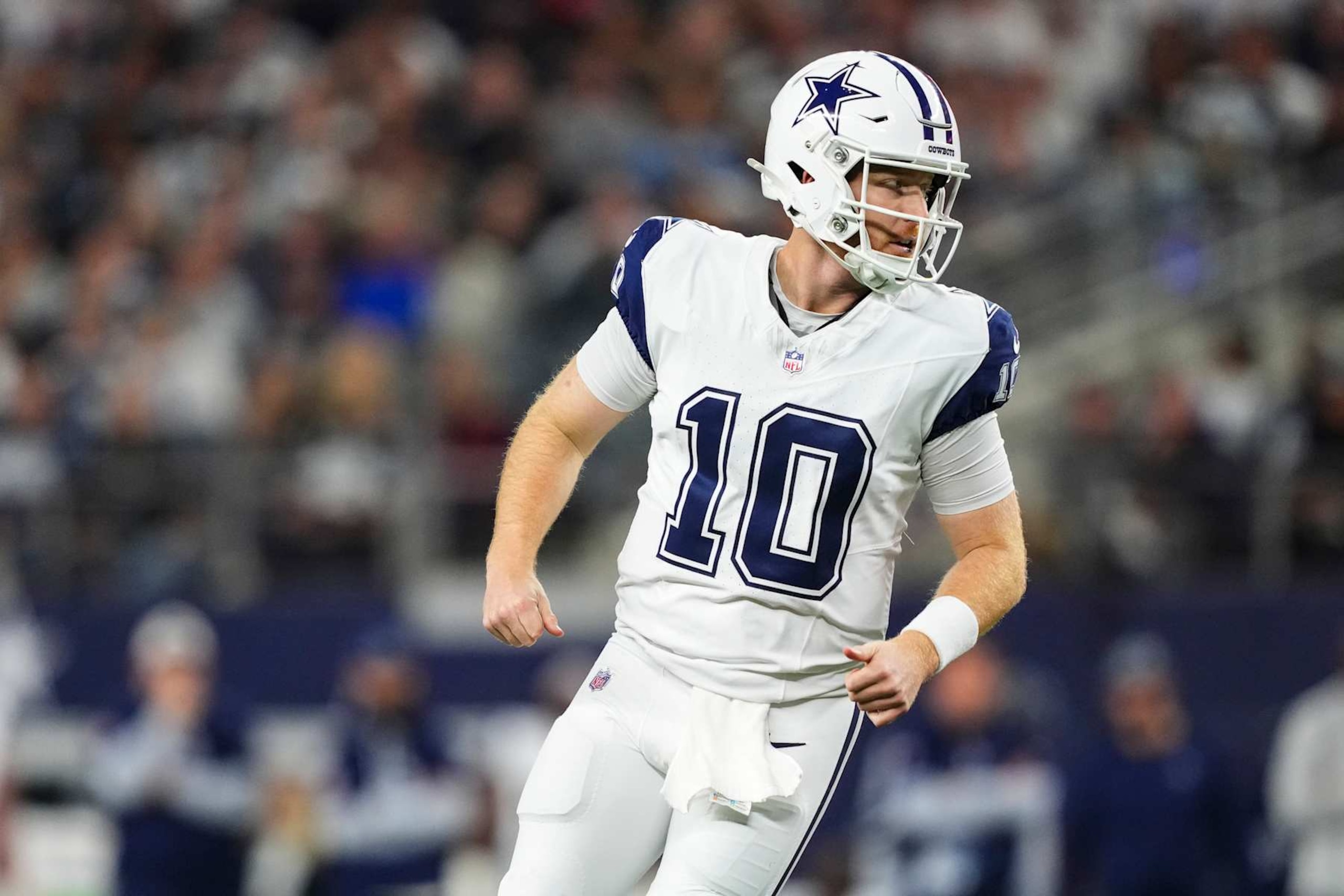 ARLINGTON, TX - DECEMBER 09: Cooper Rush #10 of the Dallas Cowboys looks on from the field during an NFL football game against the Cincinnati Bengals at AT&T Stadium on December 9, 2024 in Arlington, Texas. (Photo by Cooper Neill/Getty Images)