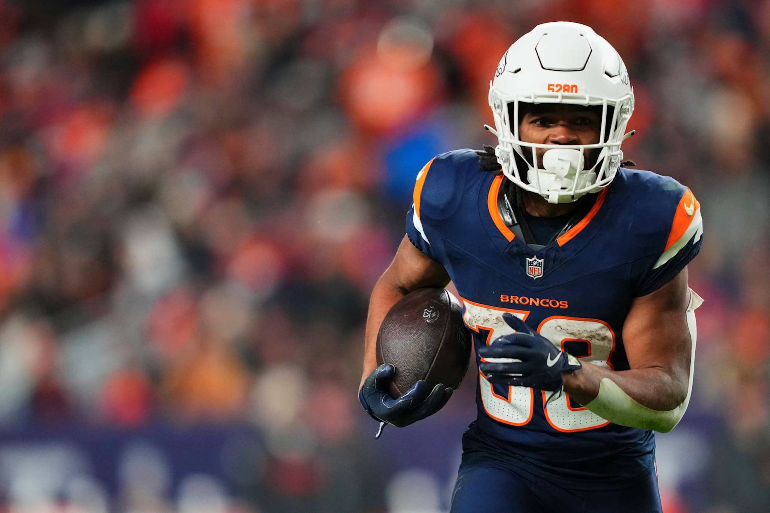 DENVER, CO - DECEMBER 02: Jaleel McLaughlin #38 of the Denver Broncos carries the ball against the Cleveland Browns during an NFL football game at Empower Field at Mile High on December 2, 2024 in Denver, Colorado. (Photo by Cooper Neill/Getty Images)