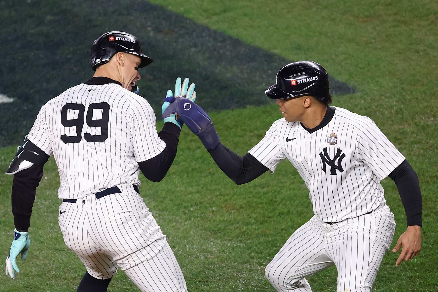 NEW YORK, NEW YORK - OCTOBER 30:  Aaron Judge #99 of the New York Yankees is congratulated by Juan Soto #22 after hitting a two-run home run during the first inning of Game Five of the 2024 World Series against the Los Angeles Dodgers at Yankee Stadium on October 30, 2024 in the Bronx borough of New York City. (Photo by Luke Hales/Getty Images)