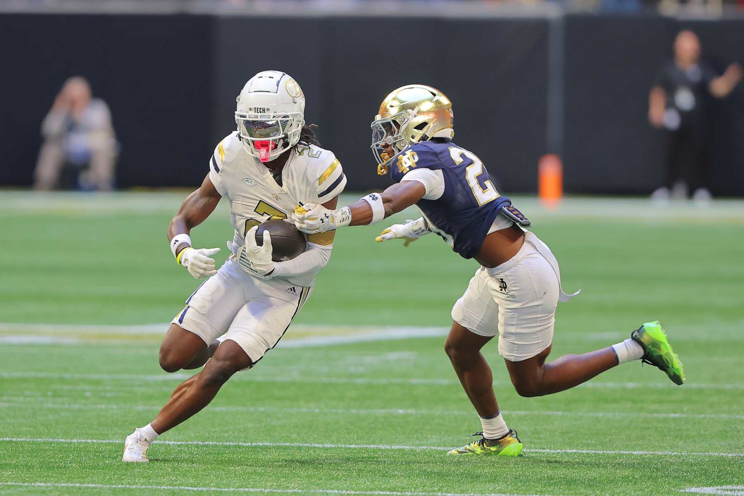 ATLANTA, GA - OCTOBER 19: Notre Dame Fighting Irish cornerback Christian Gray (29) grabs at Georgia Tech Yellow Jackets wide receiver Eric Singleton Jr. (2) during the college football game between the Georgia Tech Yellow Jackets and the Notre Dame Fighting Irish on October 19, 2024 at the Mercedes-Benz Stadium in Atlanta, Georgia.  (Photo by David J. Griffin/Icon Sportswire via Getty Images)