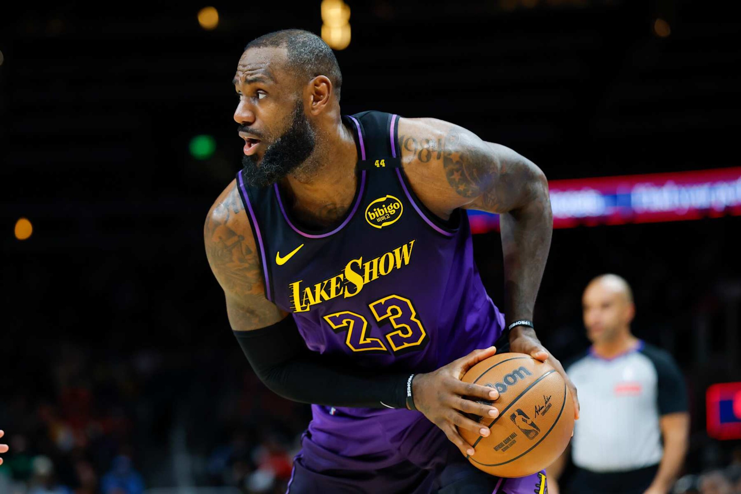 ATLANTA, GEORGIA - DECEMBER 6: LeBron James #23 of the Los Angeles Lakers looks to pass during the second quarter against the Atlanta Hawks at State Farm Arena on December 6, 2024 in Atlanta, Georgia. NOTE TO USER: User expressly acknowledges and agrees that, by downloading and or using this photograph, User is consenting to the terms and conditions of the Getty Images License Agreement. (Photo by Todd Kirkland/Getty Images)