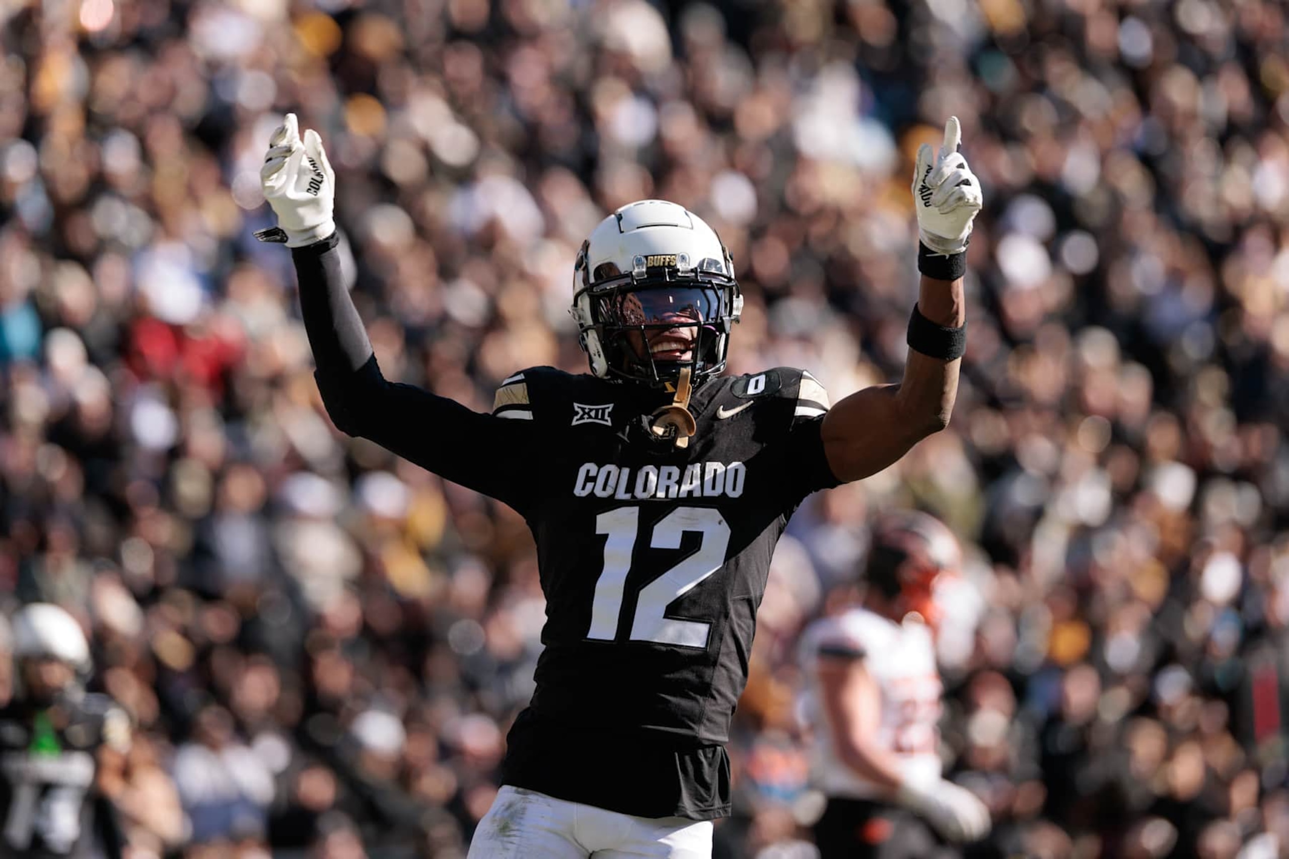 BOULDER, COLORADO - NOVEMBER 29: Travis Hunter #12 of the Colorado Buffaloes celebrates a touchdown during the third quarter against the Oklahoma State Cowboys at Folsom Field on November 29, 2024 in Boulder, Colorado. (Photo by Andrew Wevers/Getty Images) BOULDER, COLORADO - NOVEMBER 29: Travis Hunter #12 of the Colorado Buffaloes celebrates a touchdown during the third quarter against the Oklahoma State Cowboys at Folsom Field on November 29, 2024 in Boulder, Colorado. (Photo by Andrew Wevers/Getty Images)