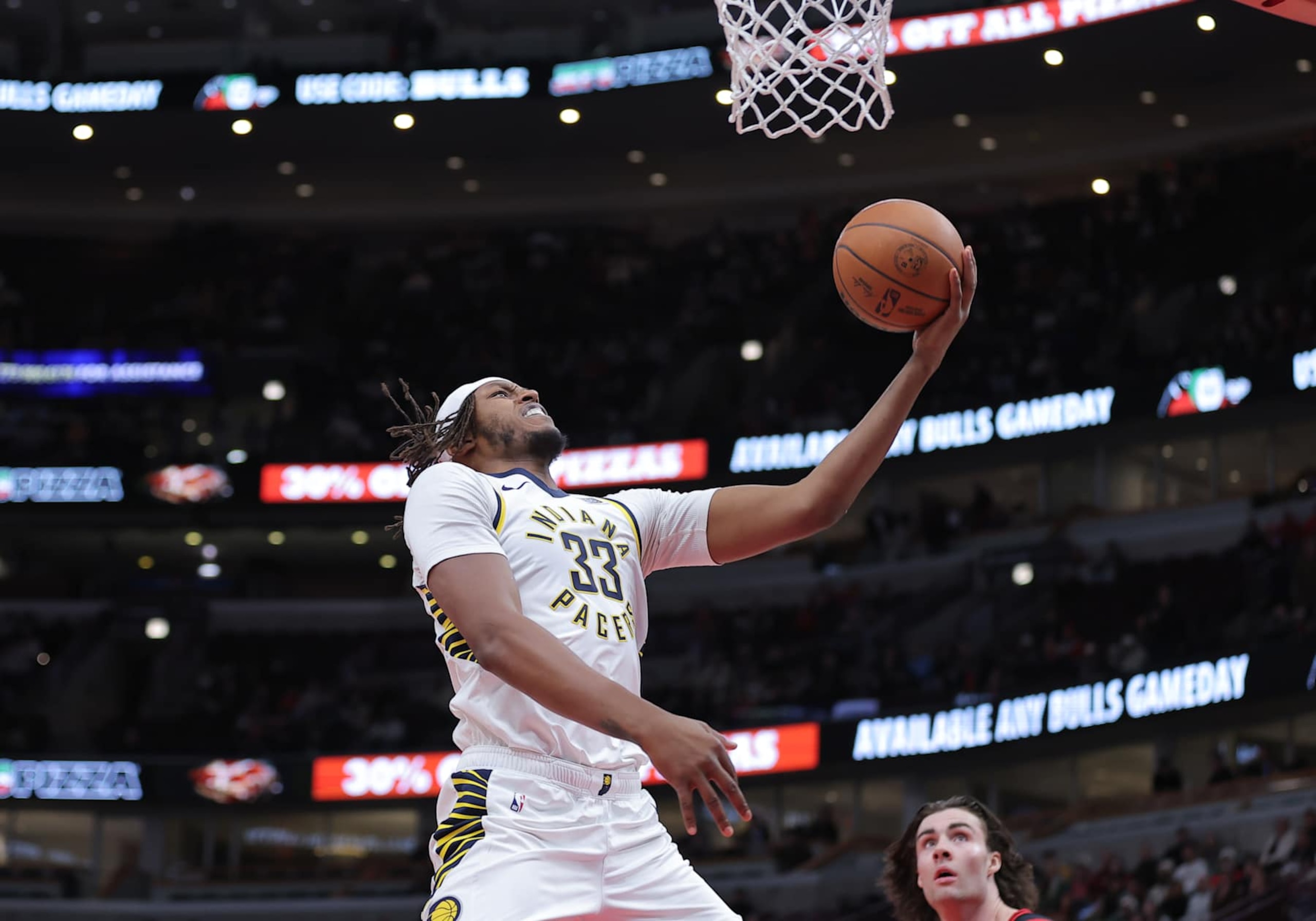 CHICAGO, IL - DECEMBER 06: Myles Turner #33 of the Indiana Pacers drives to the basket for a layup during the first half against the Chicago Bulls on December 6, 2024 at the United Center in Chicago,Illinois. (Photo by Melissa Tamez/Icon Sportswire via Getty Images) CHICAGO, IL - DECEMBER 06: Myles Turner #33 of the Indiana Pacers drives to the basket for a layup during the first half against the Chicago Bulls on December 6, 2024 at the United Center in Chicago,Illinois. (Photo by Melissa Tamez/Icon Sportswire via Getty Images)
