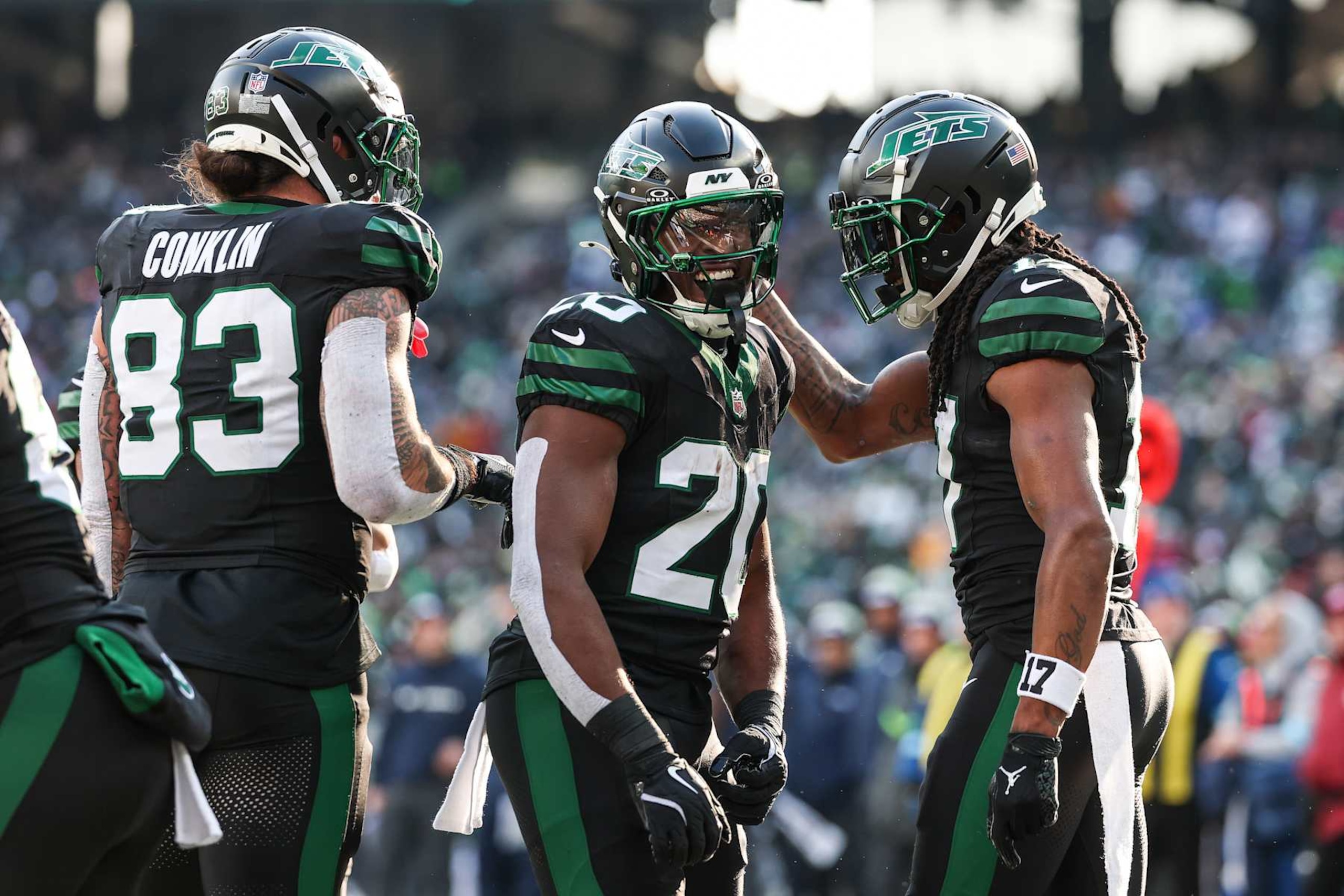 EAST RUTHERFORD, NEW JERSEY - DECEMBER 01: Breece Hall #20 of the New York Jets celebrates with teammate Davante Adams #17 after a touchdown in the first quarter of a game against the Seattle Seahawks at MetLife Stadium on December 01, 2024 in East Rutherford, New Jersey. (Photo by Elsa/Getty Images)